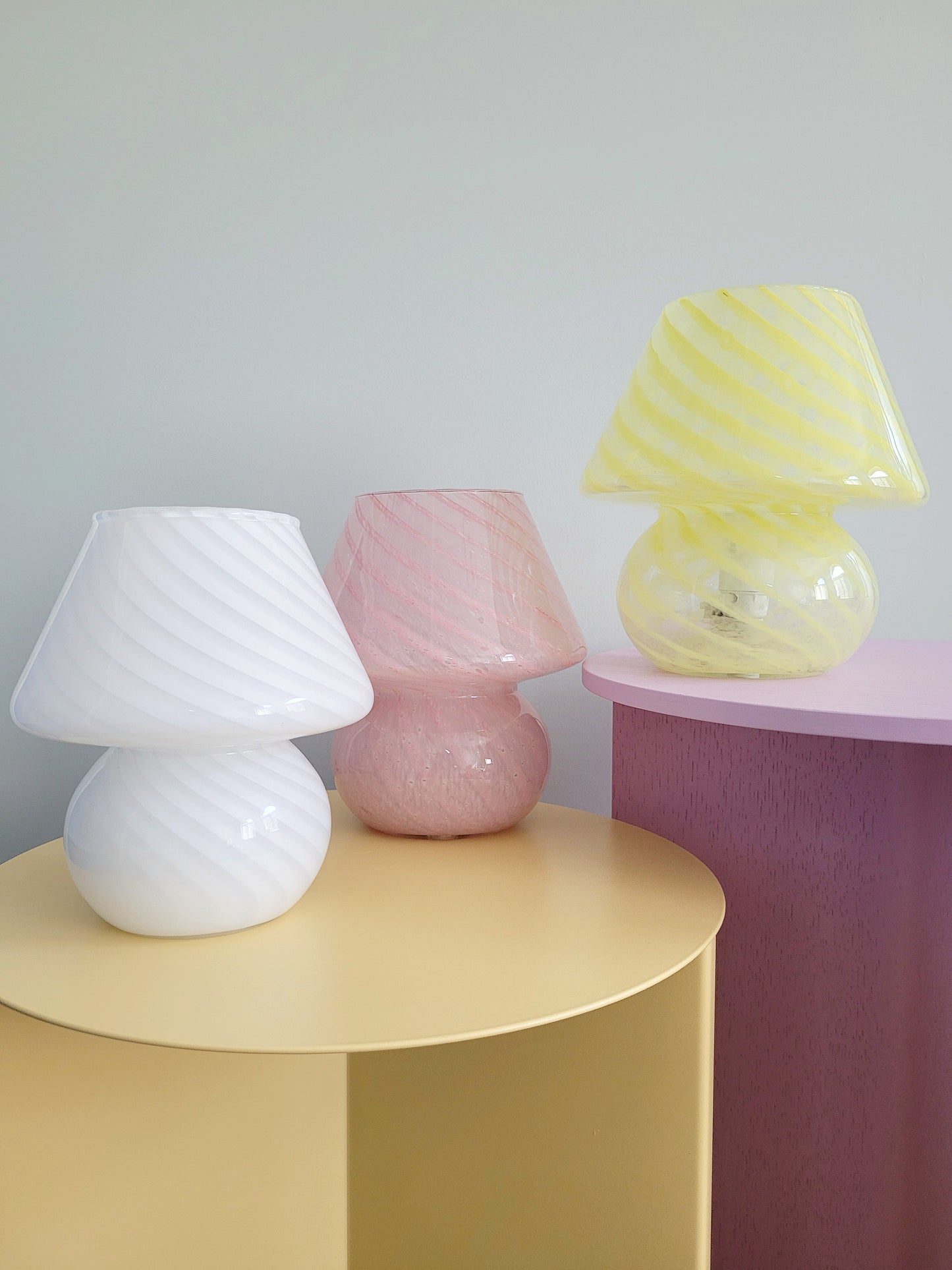 full view of a trio of small colourful vintage Murano mushroom table lamps with yellow pink and white swirls