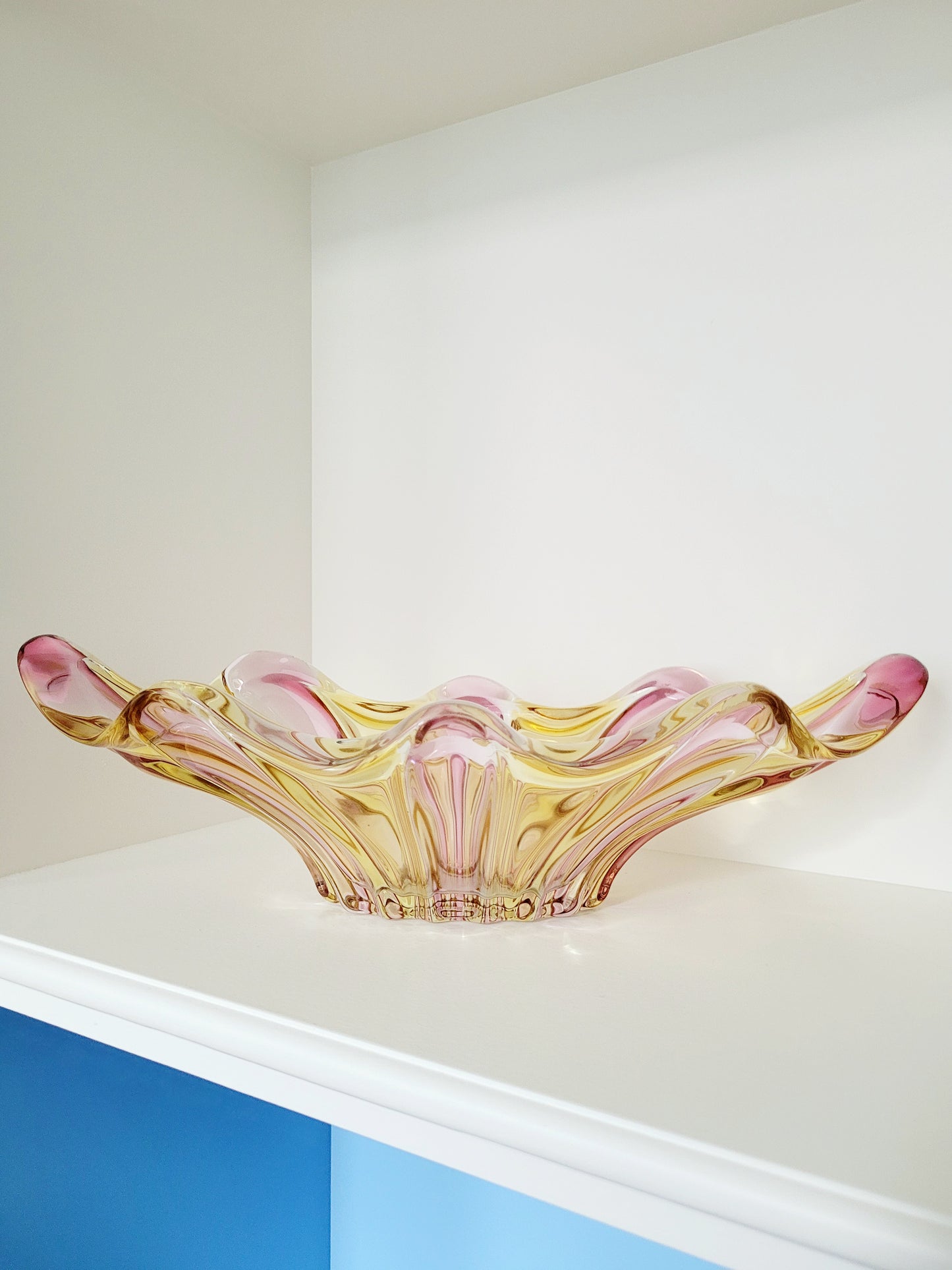 full view of a vibrant candy coloured glass serving or trinket bowl in yellow and pink