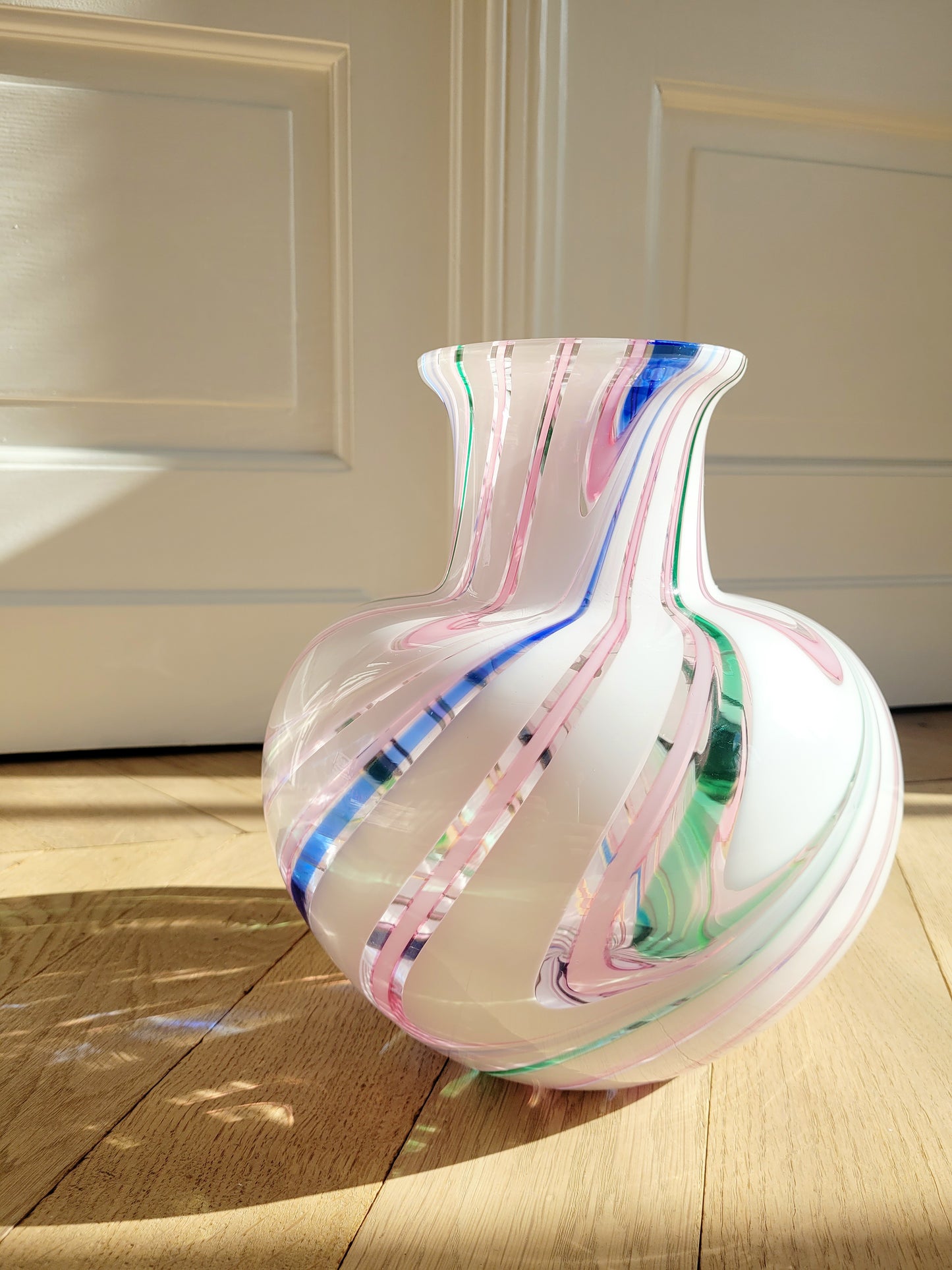 front view of a vintage Michielotto Murano multi swirl vase in a multitude of hues