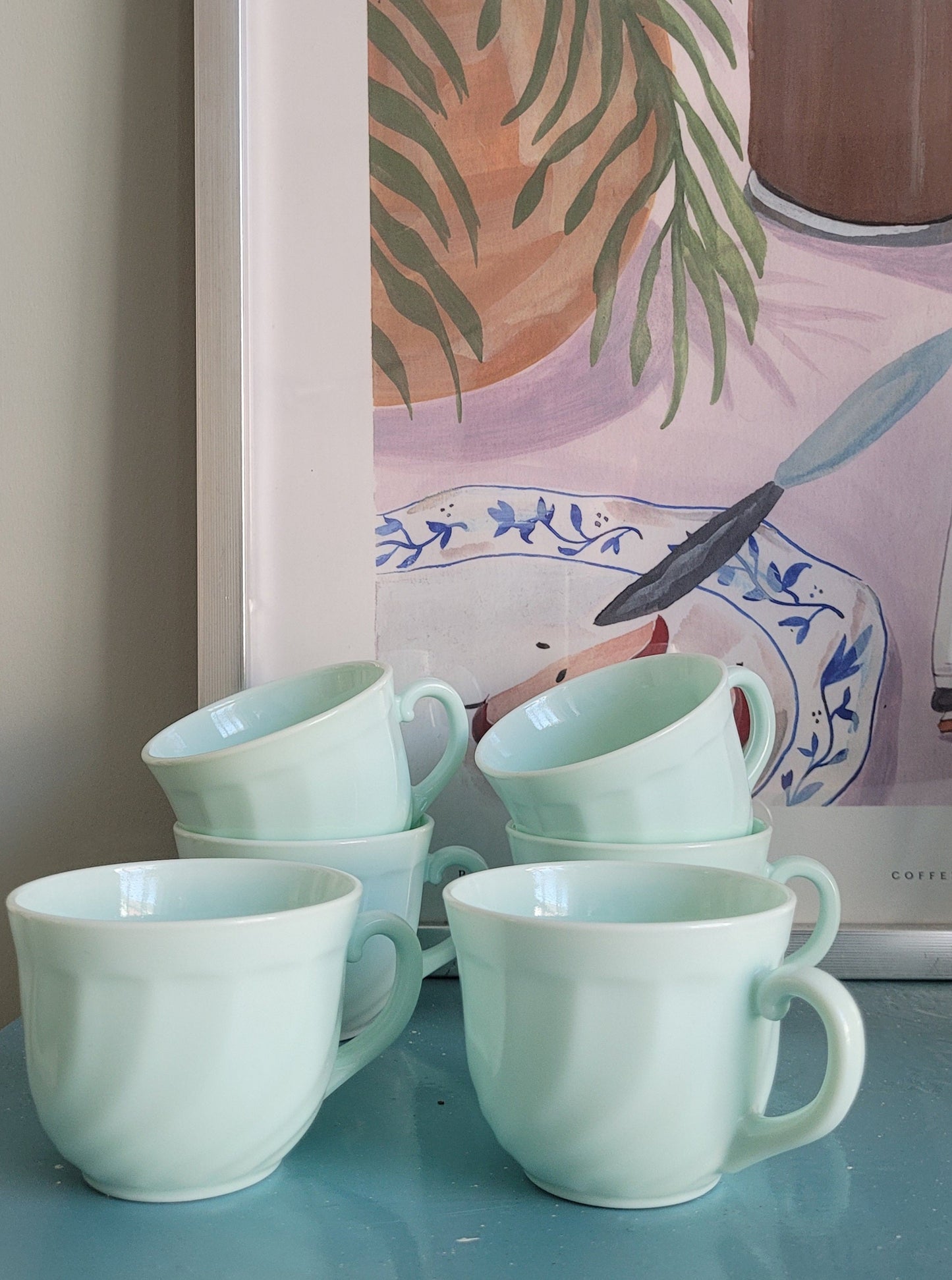 front view of six Arcopal France opaline cups for coffee or tea
