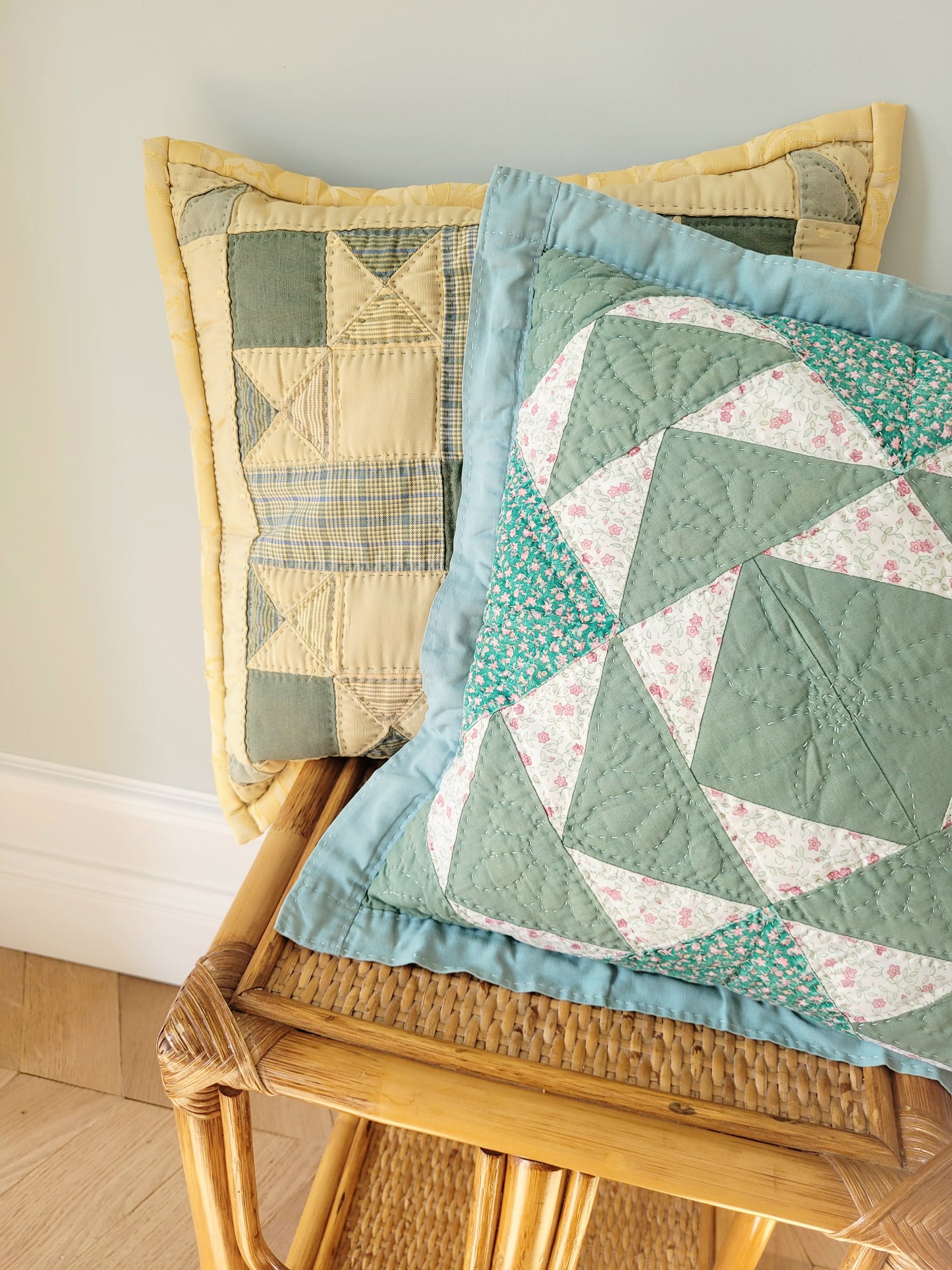 front view of quilted cushions in green and yellow hues and pattern