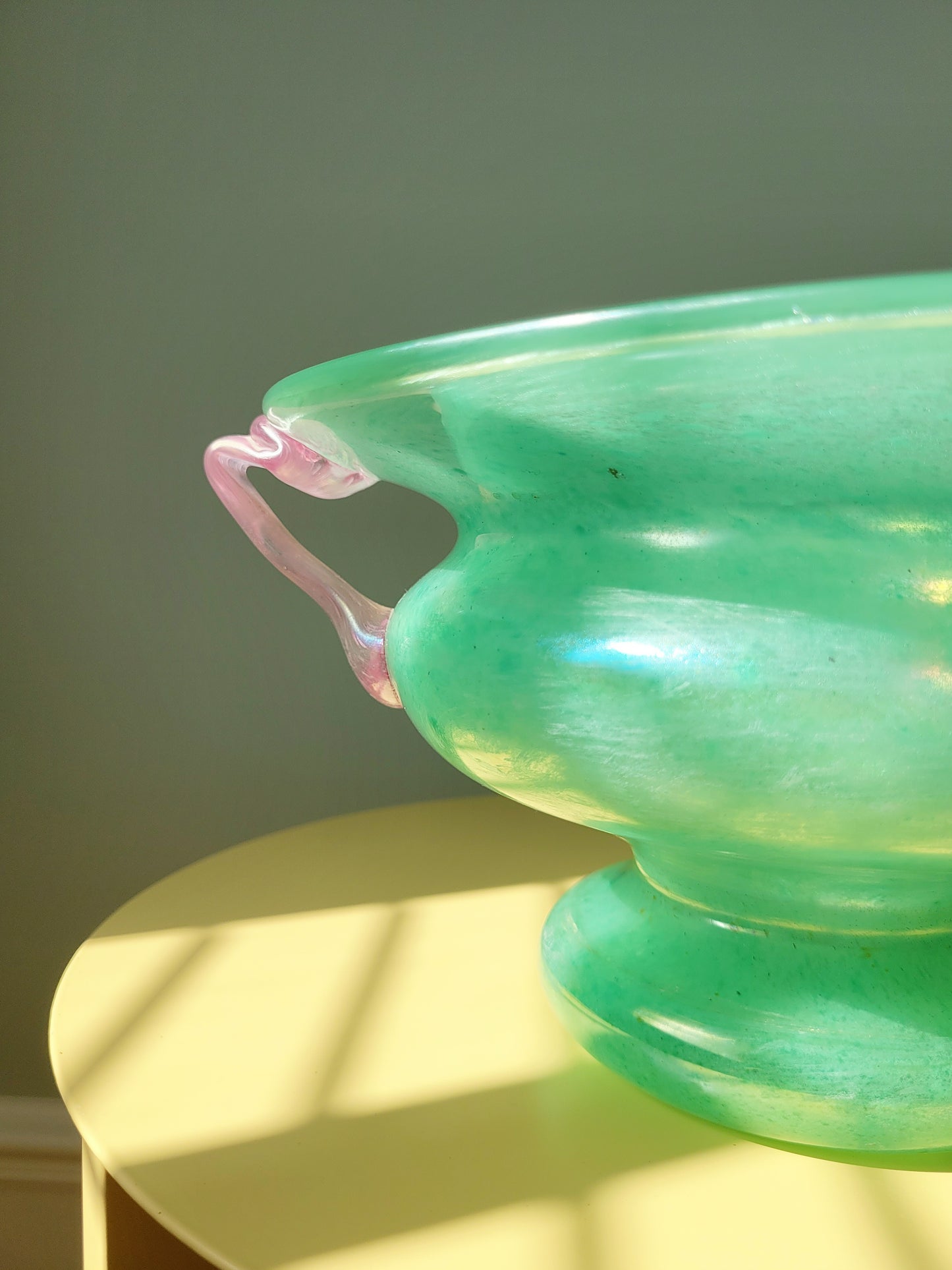 detail of a scavo Murano glass amphora vase in green and pink