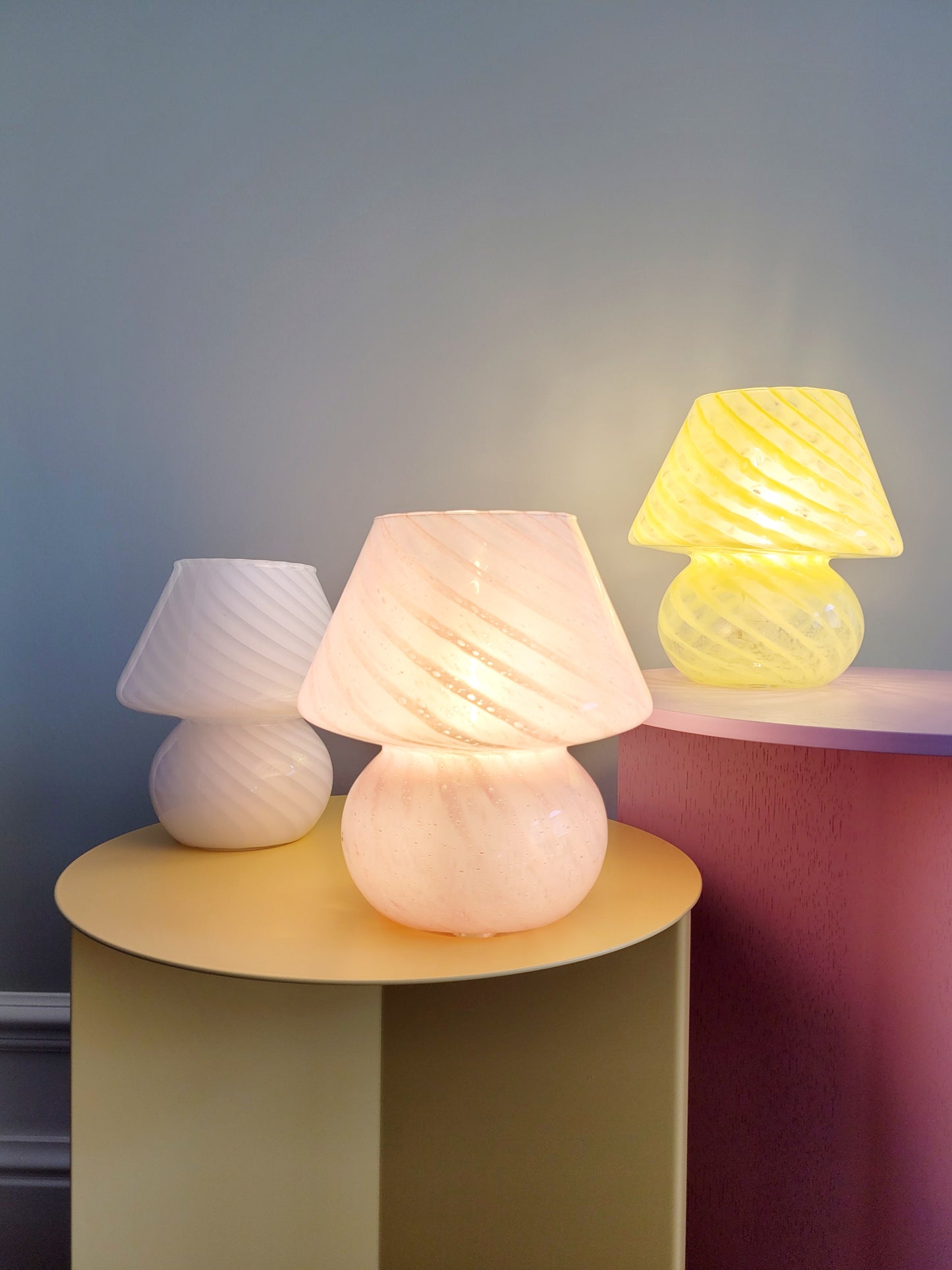 full view of a trio of small colourful vintage Murano mushroom table lamps with yellow pink and white swirls