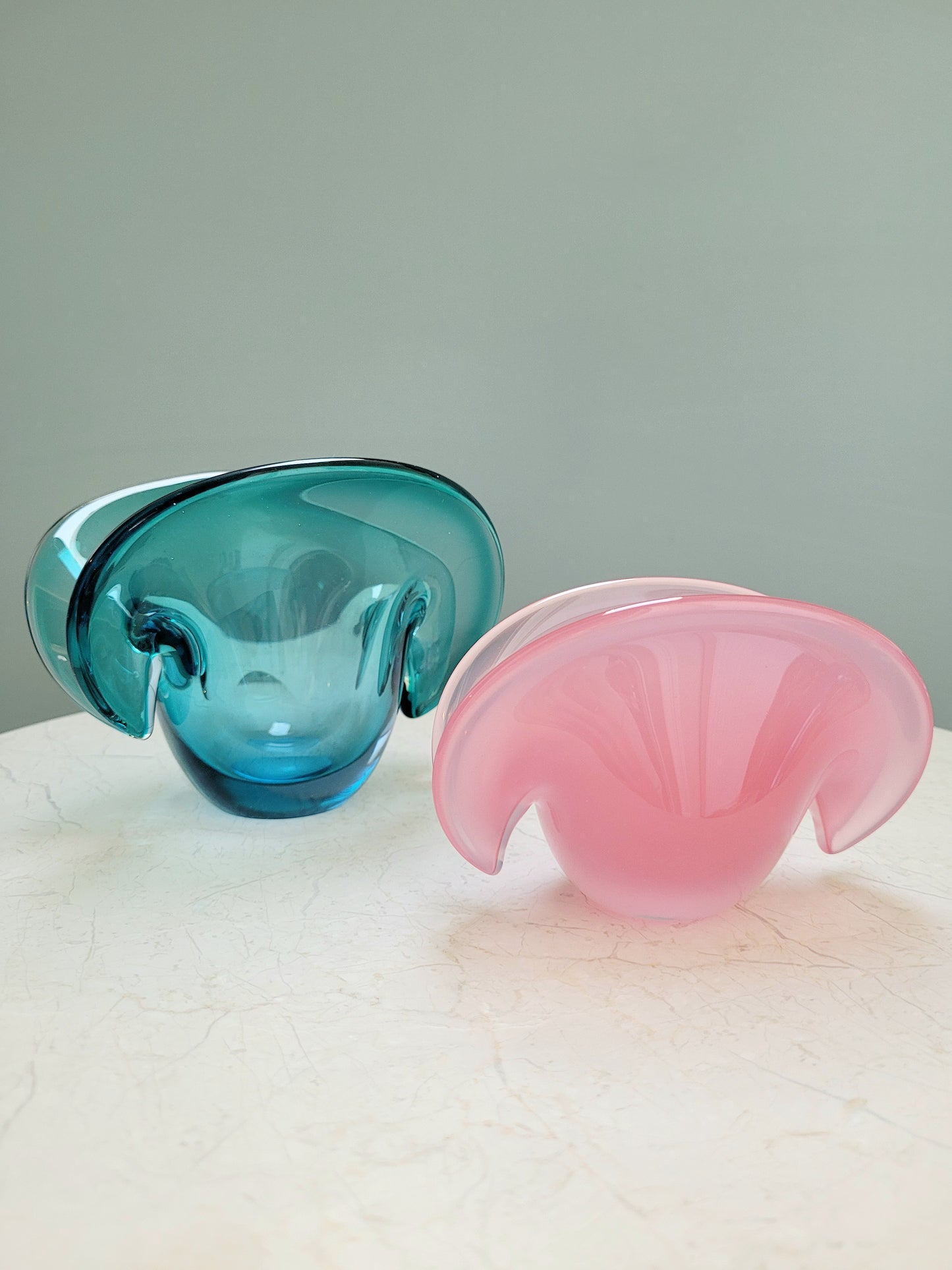 side view of vintage Murano clam bowls in colourful blue and pink