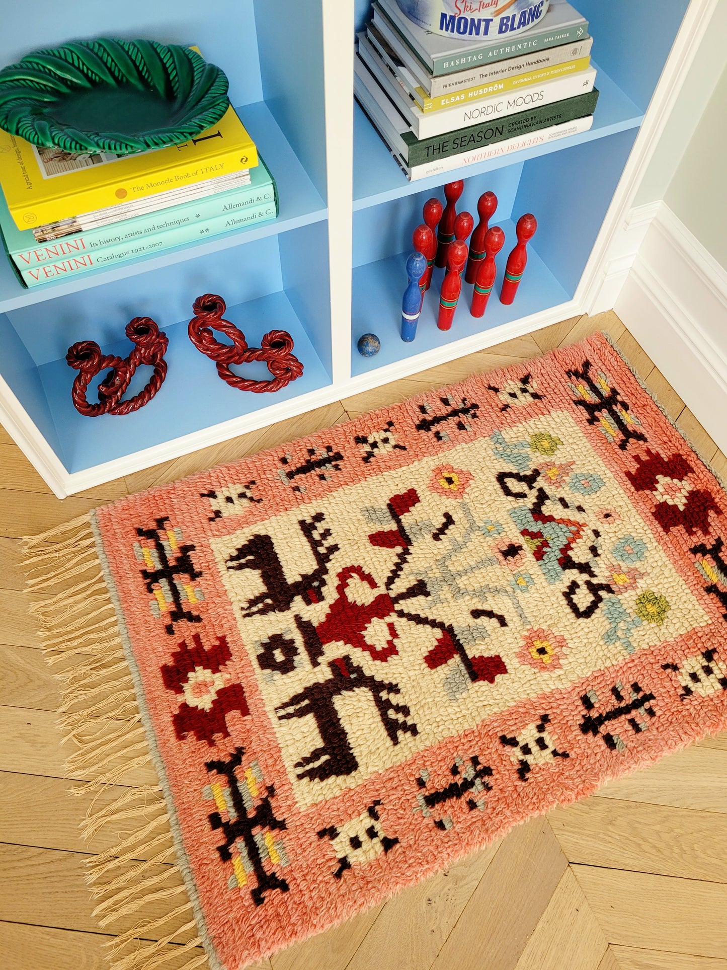 side view of a vintage colourful Scandinavian Rya rug made from wool