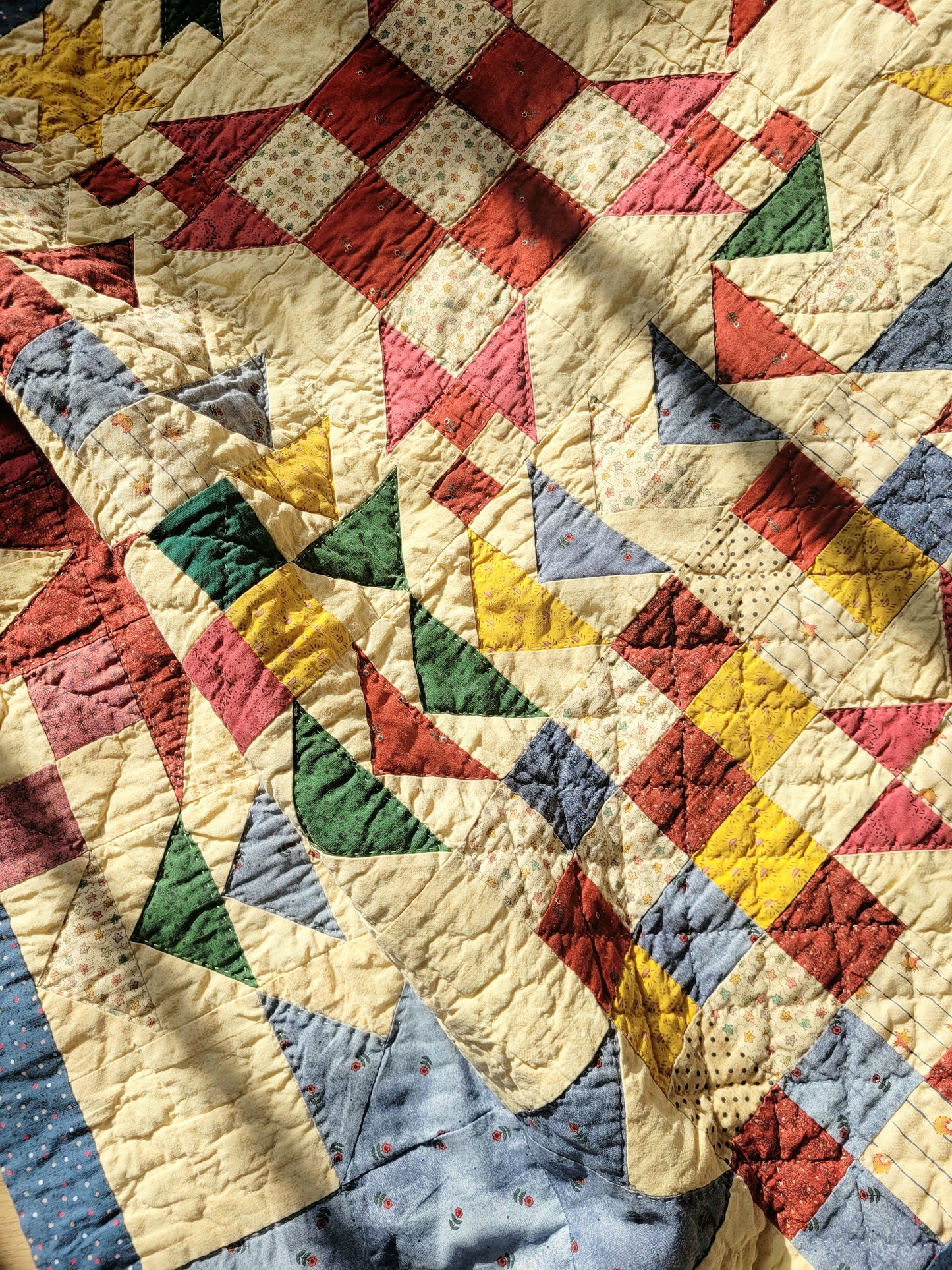 detail of a colourful patchwork quilt with geometrical pattern