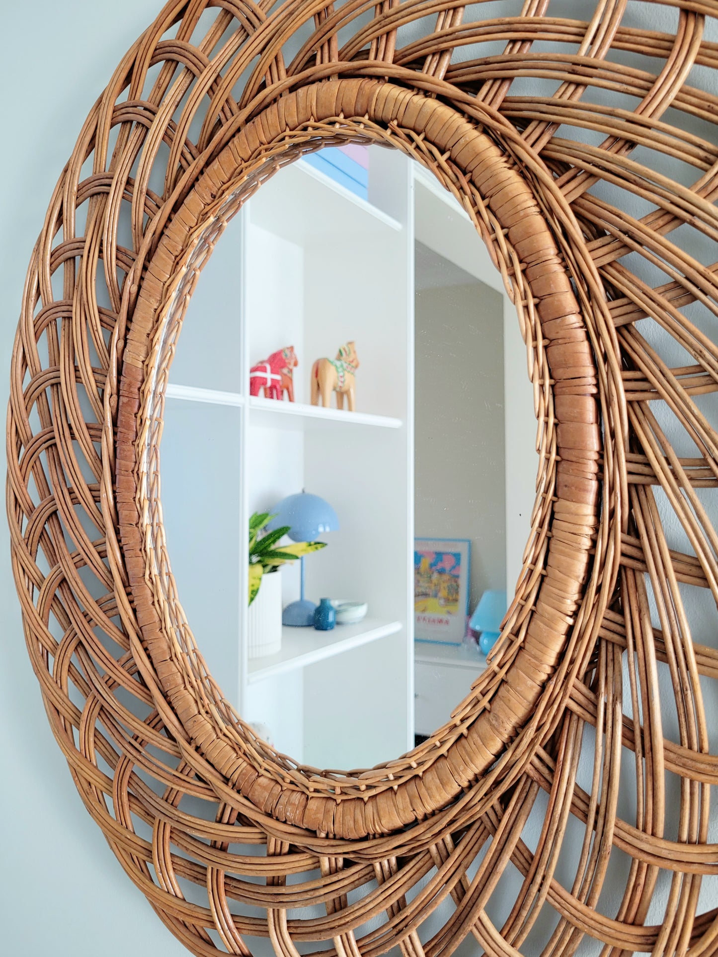 detail of a mid century large oval wall mirror