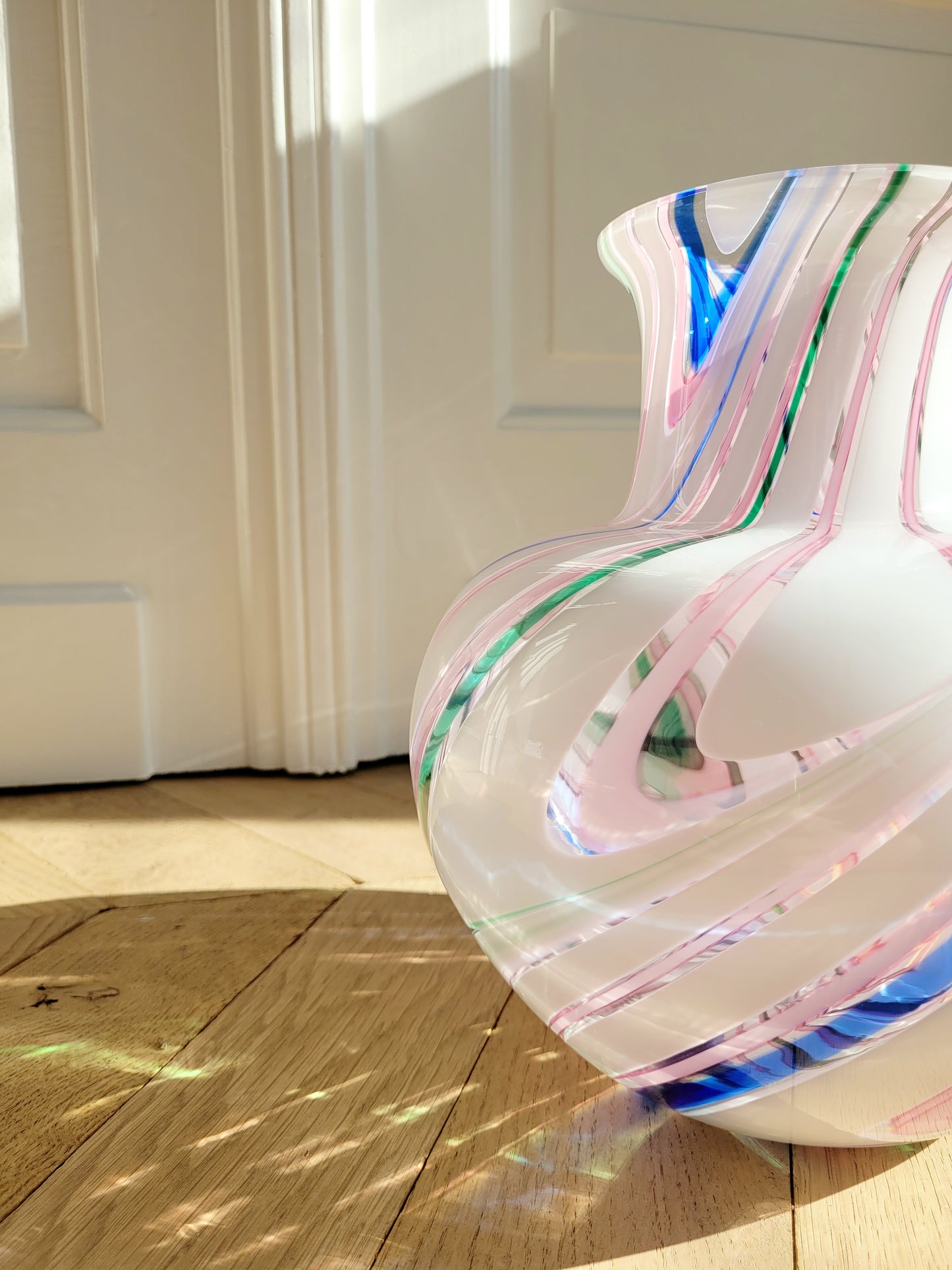 detail of a vintage Michielotto Murano multi swirl vase in a multitude of hues