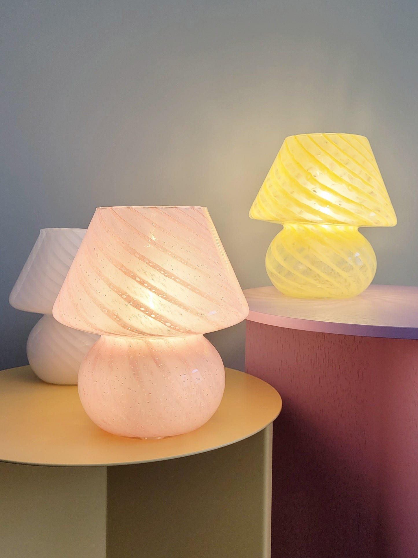 full view of a trio of small colourful vintage Murano mushroom table lamps with yellow pink and white swirls
