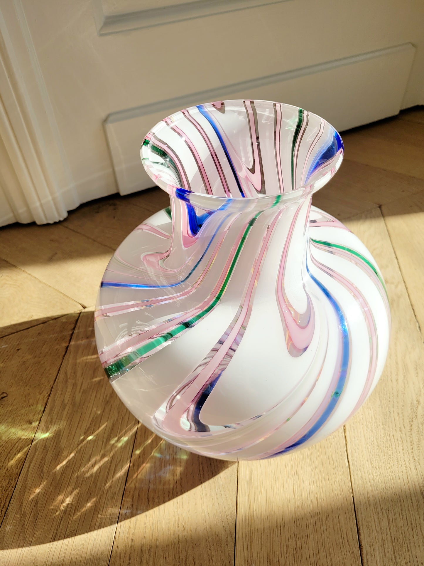 side view of a vintage Michielotto Murano multi swirl vase in a multitude of hues