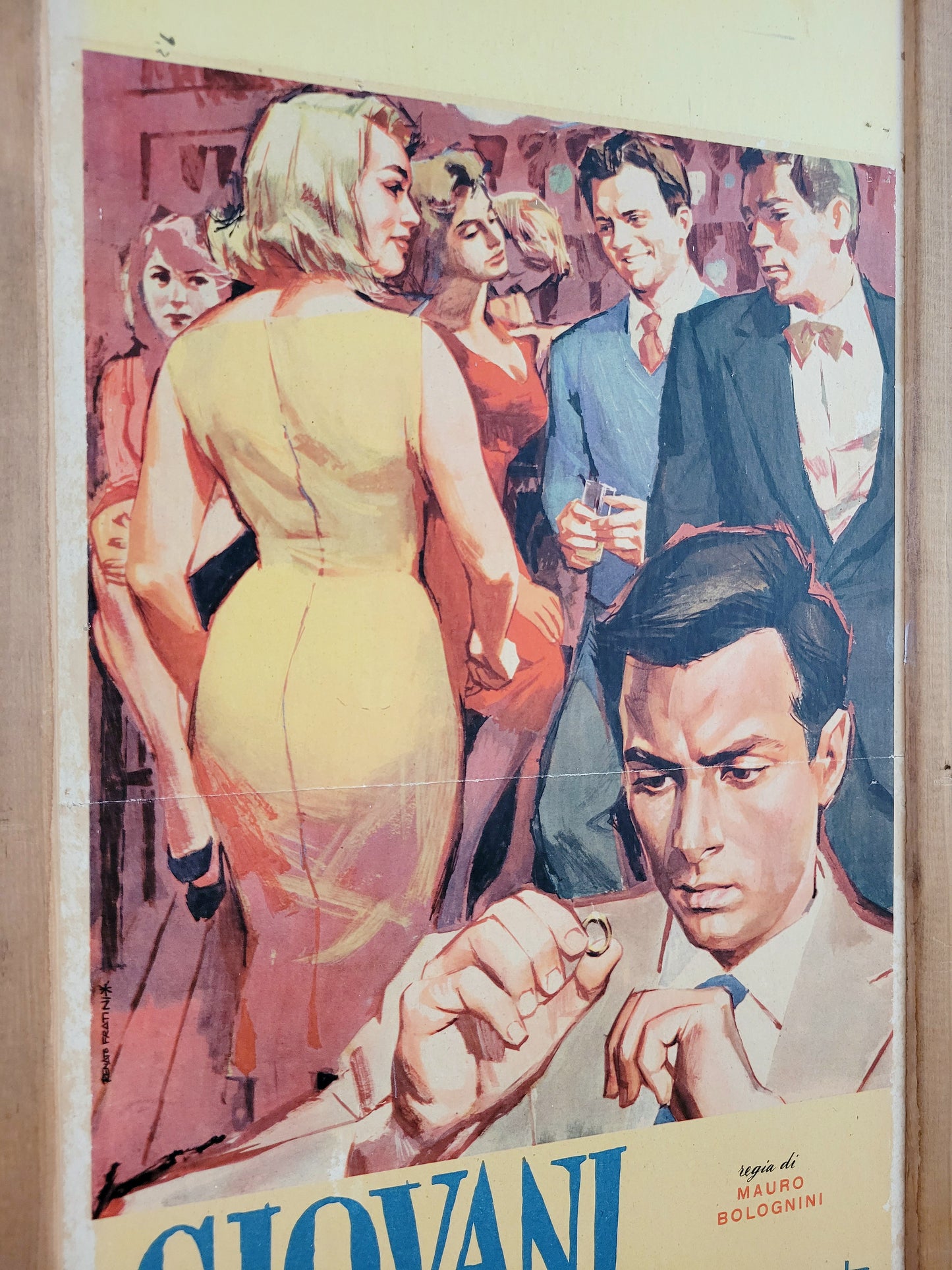 detail of an Italian movie poster of "Giovani Mariti Young Husbands from the golden age of Italian cinema