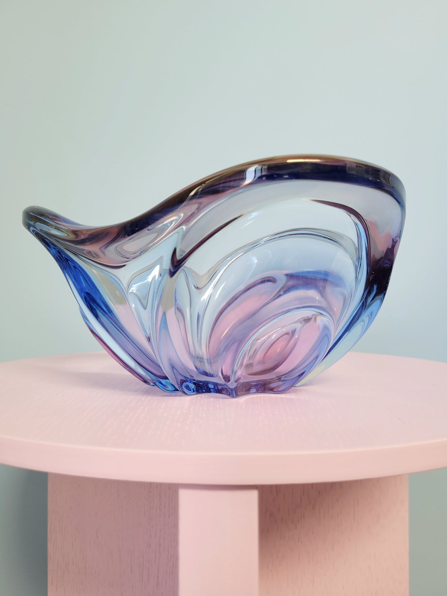 side view of a unique blue and pink glass bowl