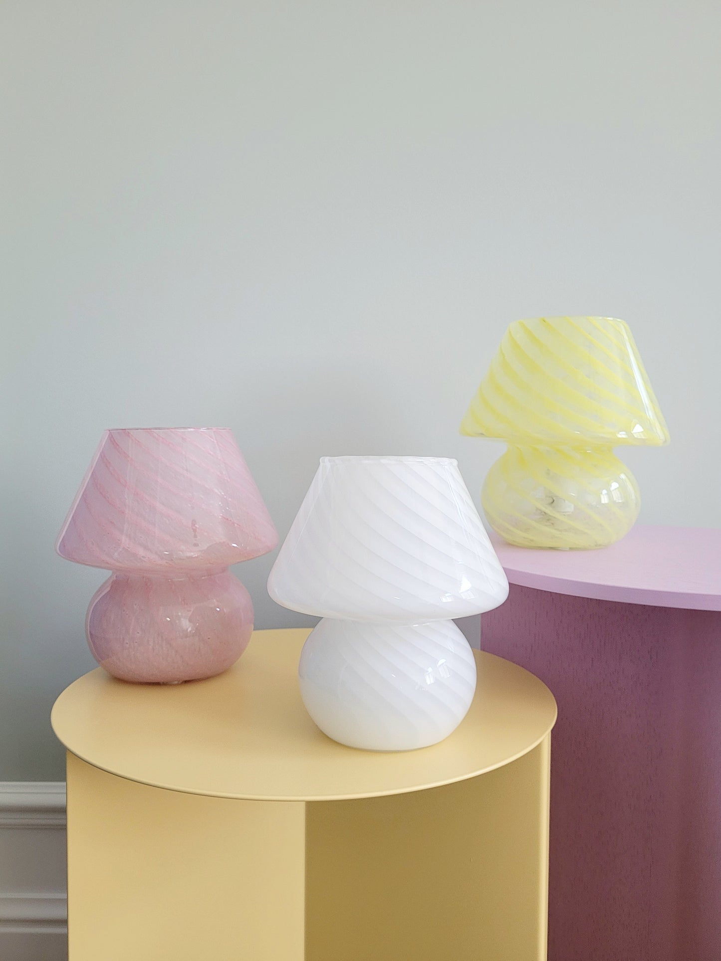 full view of a trio of small colourful vintage Murano mushroom table lamps with yellow pink and white swirls