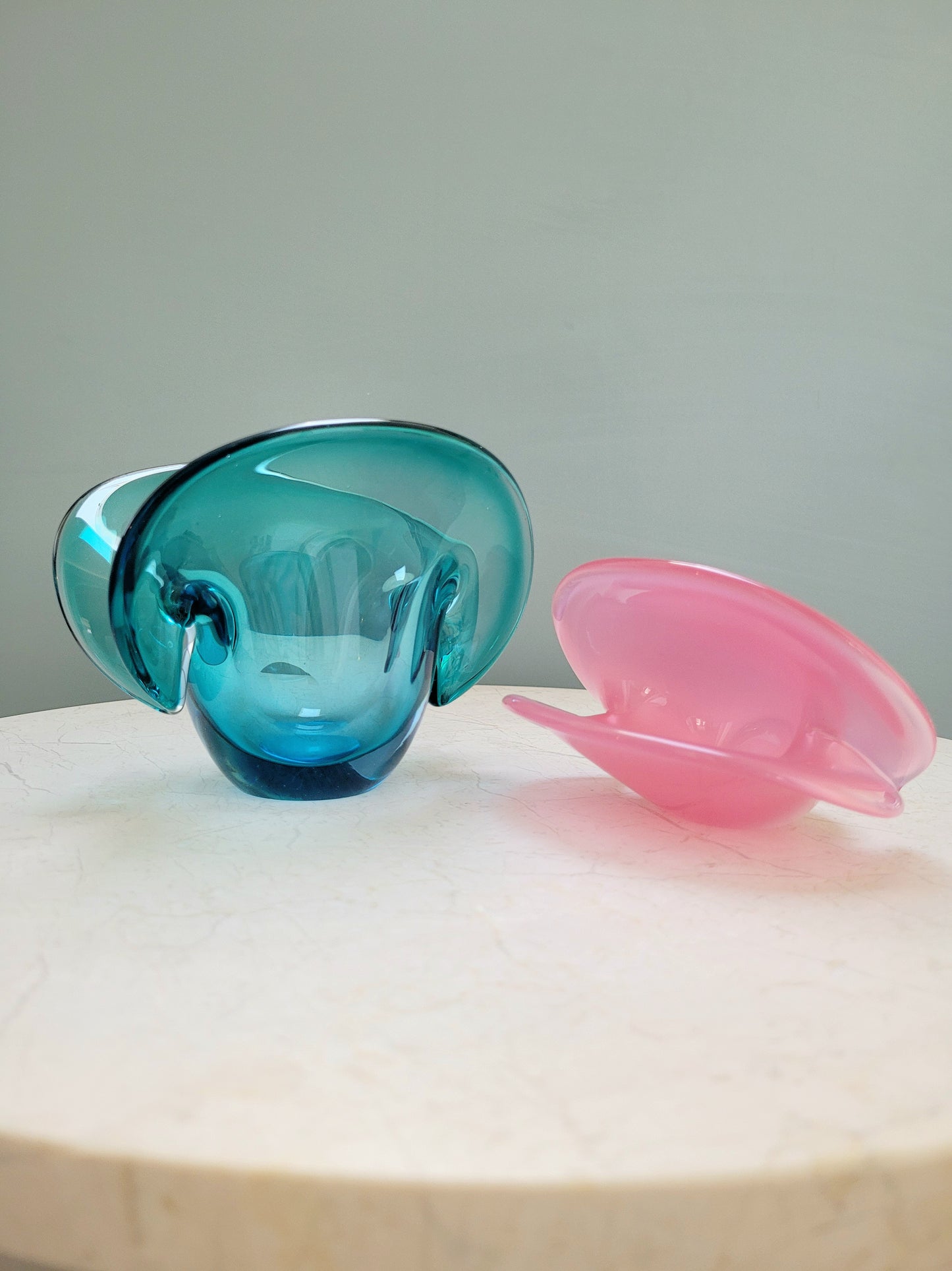 side view of vintage Murano clam bowls in colourful blue and pink