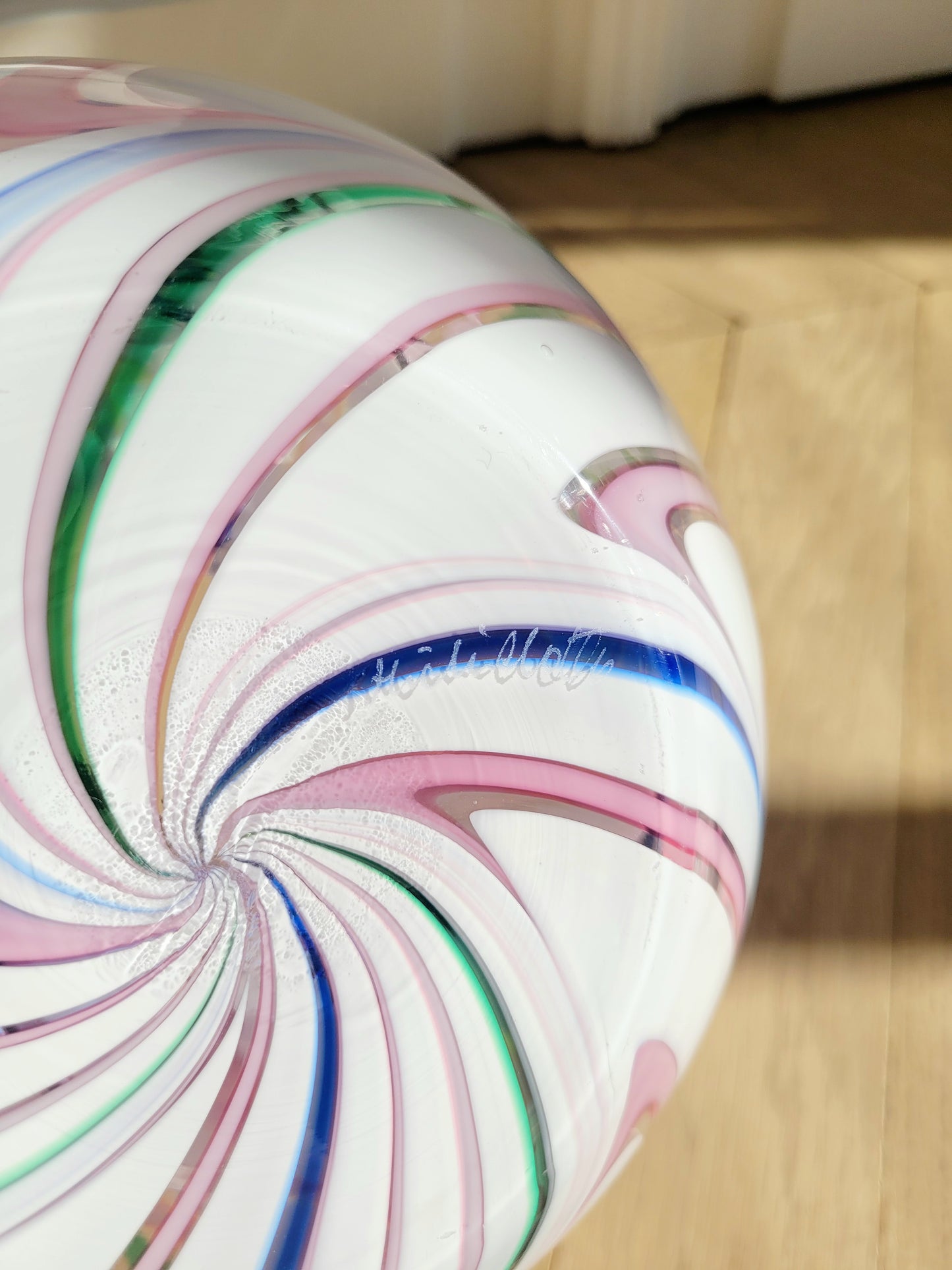 bottom view of a vintage Michielotto Murano multi swirl vase in a multitude of hues