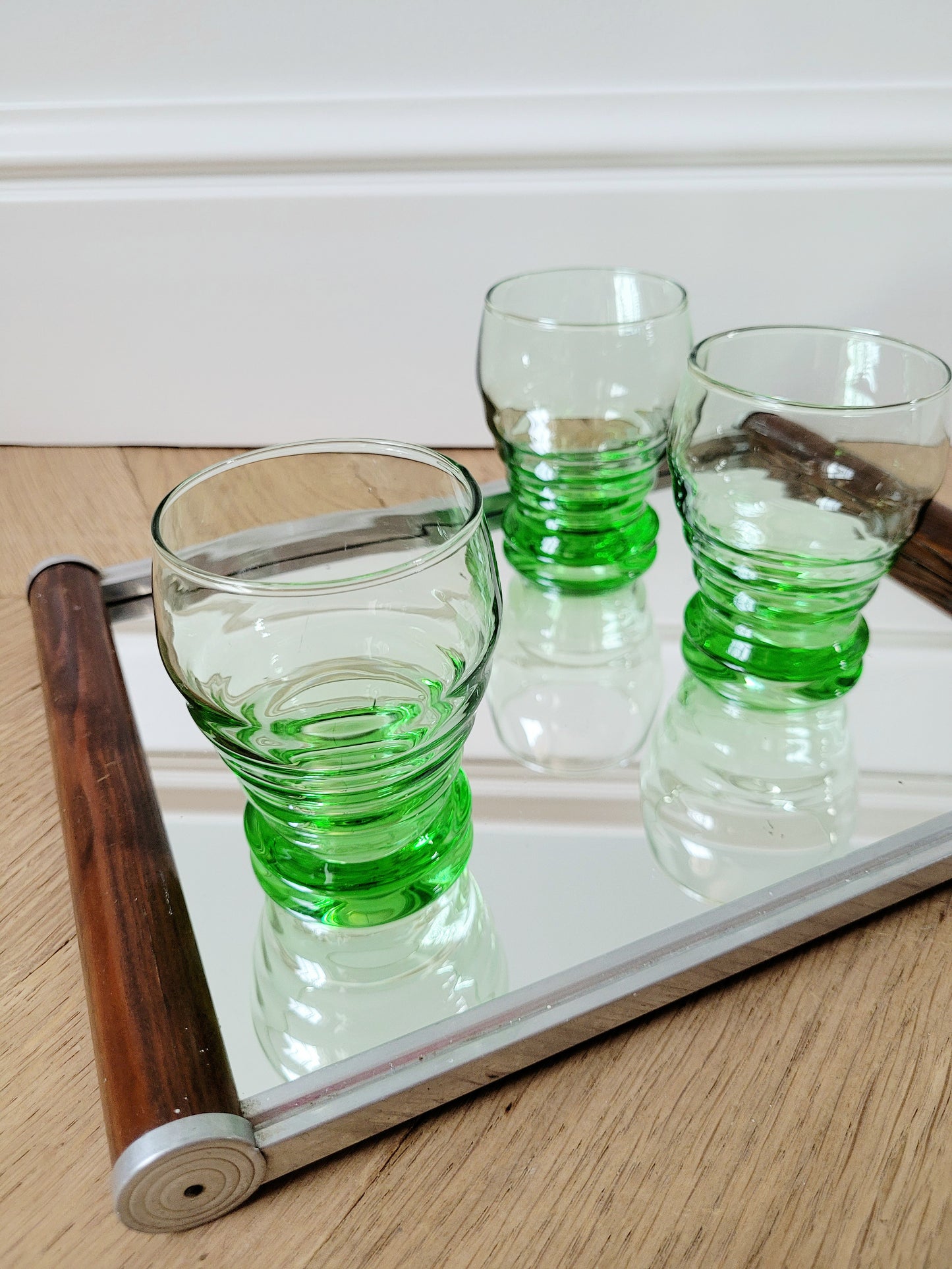 full view of bright green art deco drinking glasses on a mirror tray 6pc