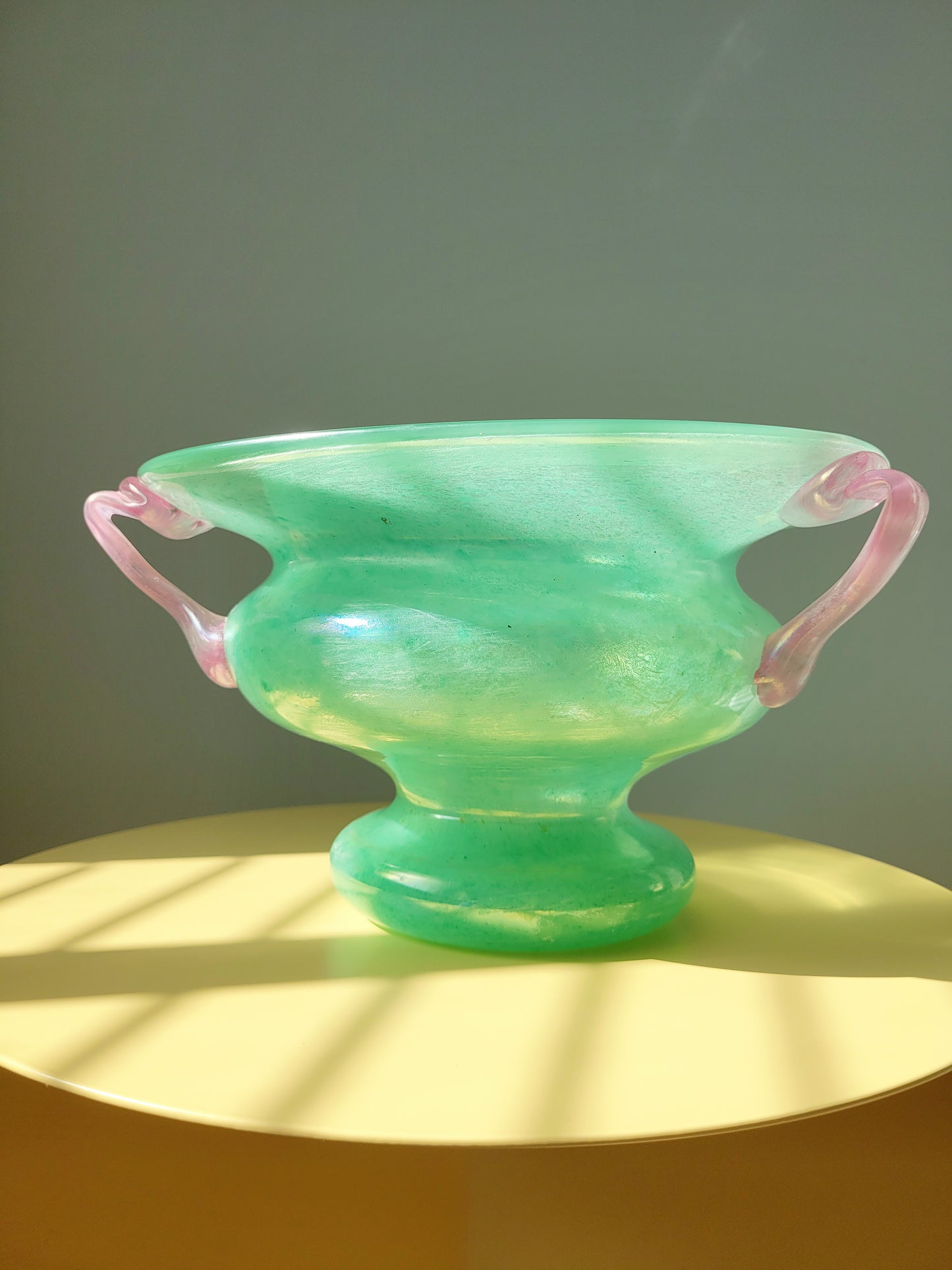 front view of a scavo Murano glass amphora vase in green and pink