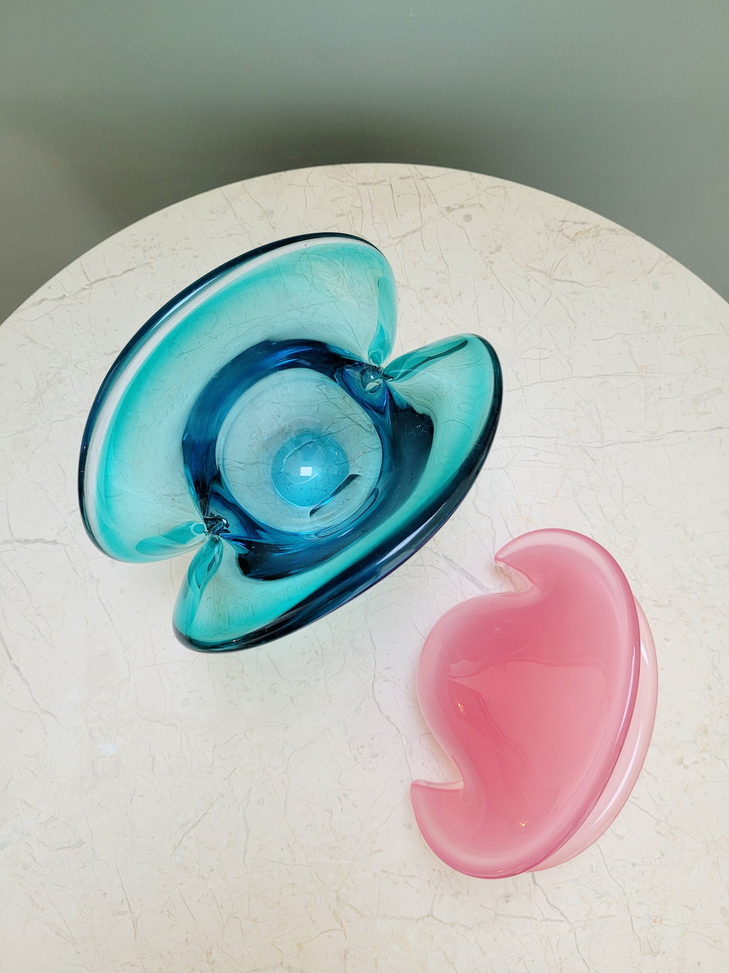 top view of vintage Murano clam bowls in colourful blue and pink