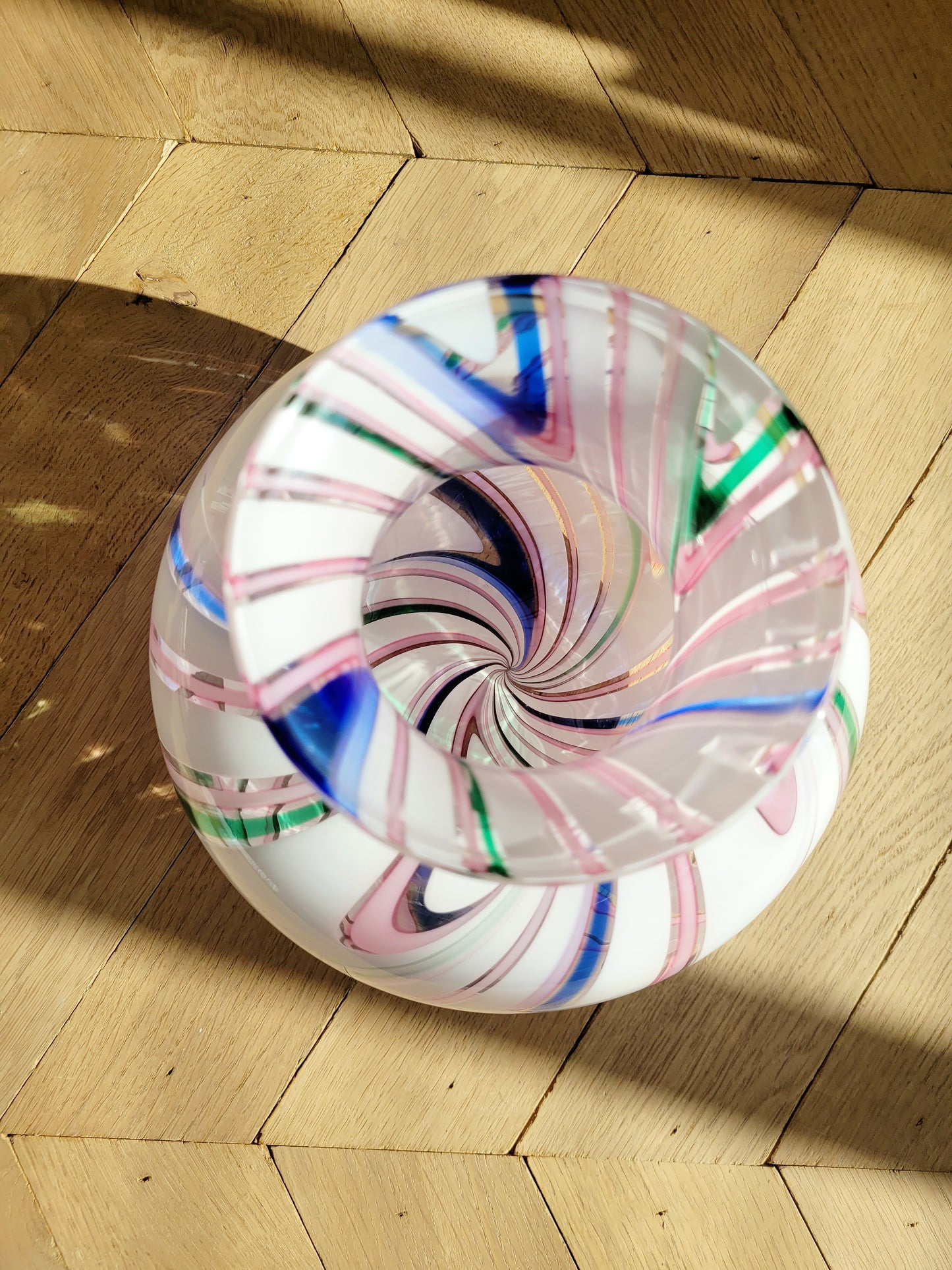 top view of a vintage Michielotto Murano multi swirl vase in a multitude of hues