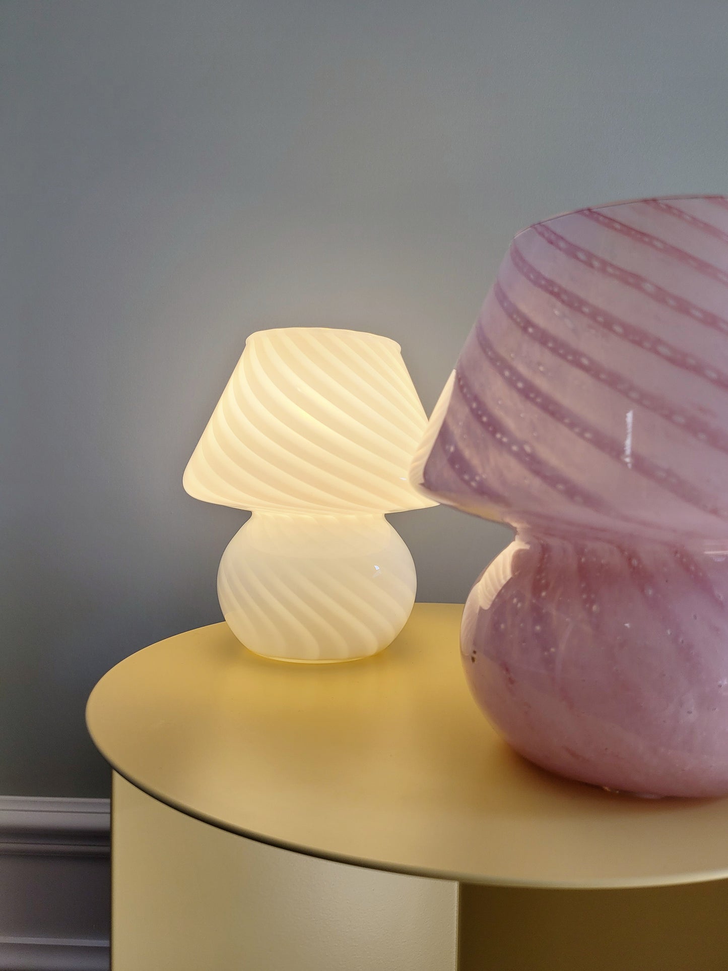 front view of small colourful vintage Murano mushroom table lamps with pink and white swirls