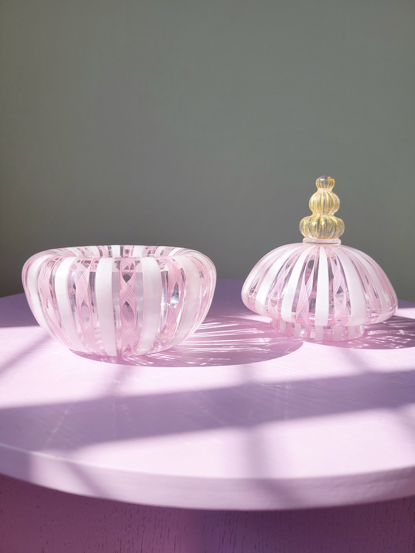 detail of a handcrafted vintage striped Murano bonbonniere in pink white and gold