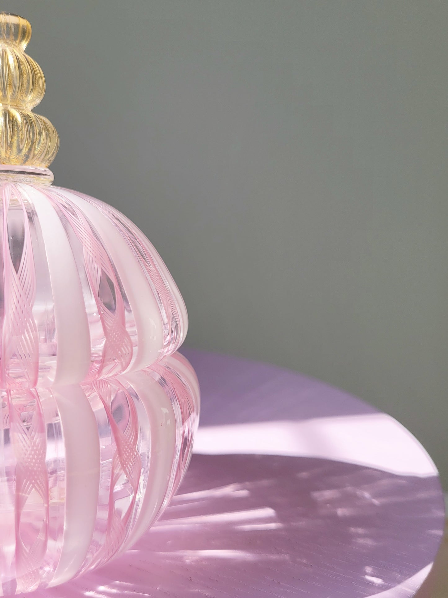 detail of a handcrafted vintage striped Murano bonbonniere in pink white and gold