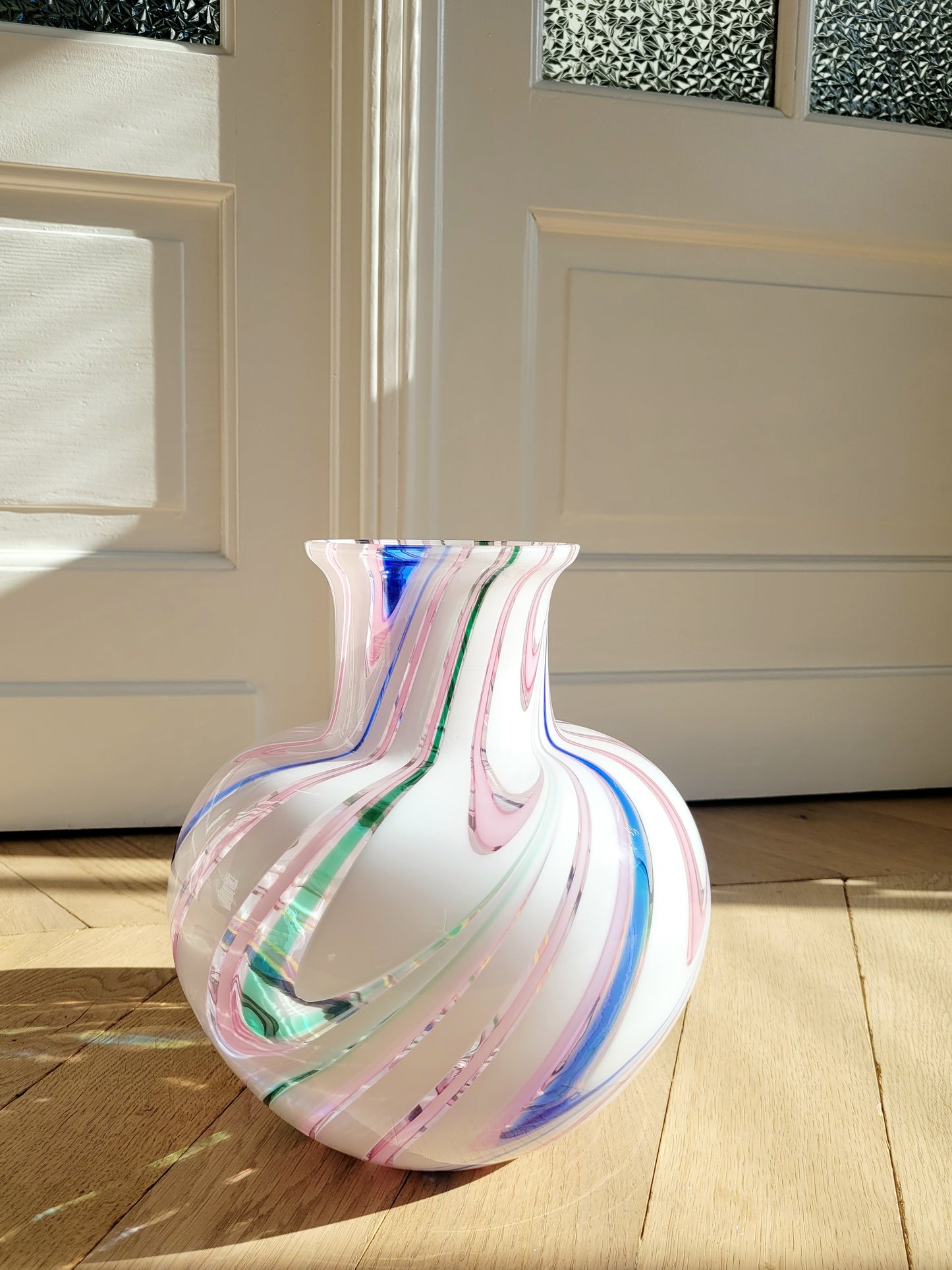 front view of a vintage Michielotto Murano multi swirl vase in a multitude of hues