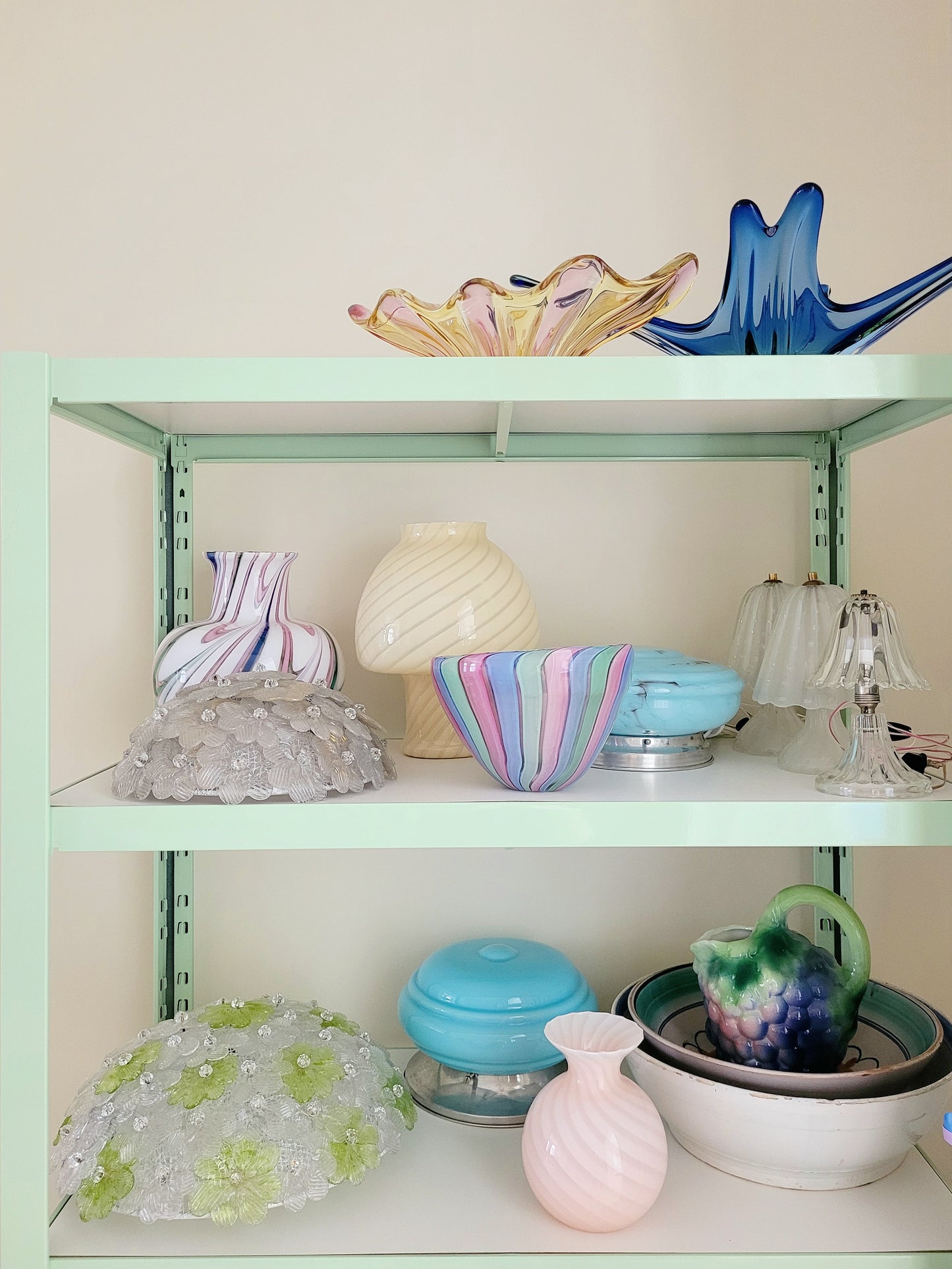 rack with colourful vintage Murano vases and lamps