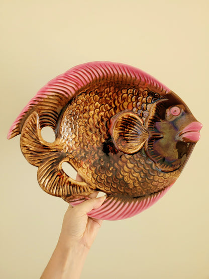 full view of a quirky ceramic serving bowl in fish shape in purple pink and brown
