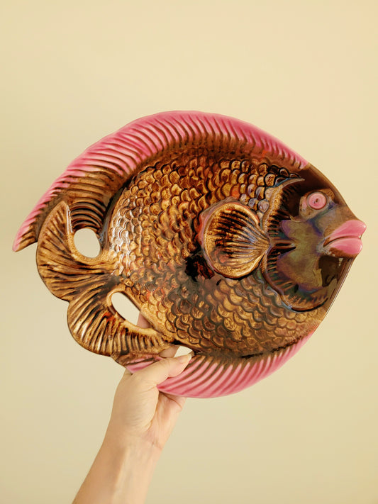 full view of a quirky ceramic serving bowl in fish shape in purple pink and brown
