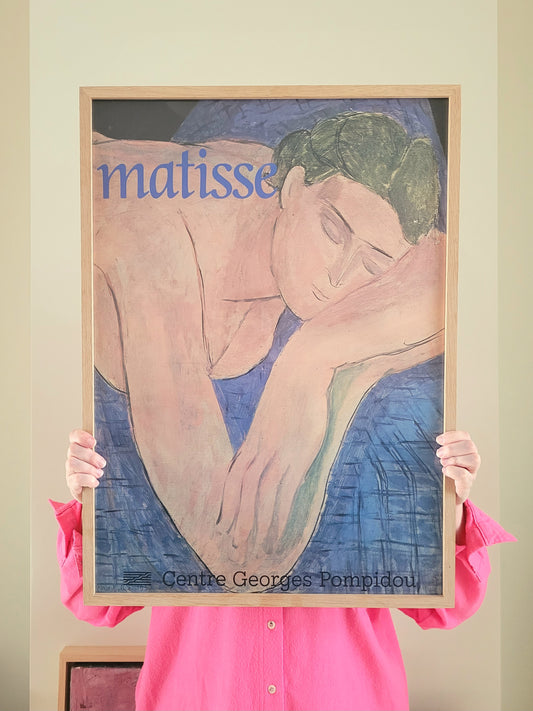 front view of an exhibition poster featuring Henri Matisse's iconic artwork Le Rêve The Dream