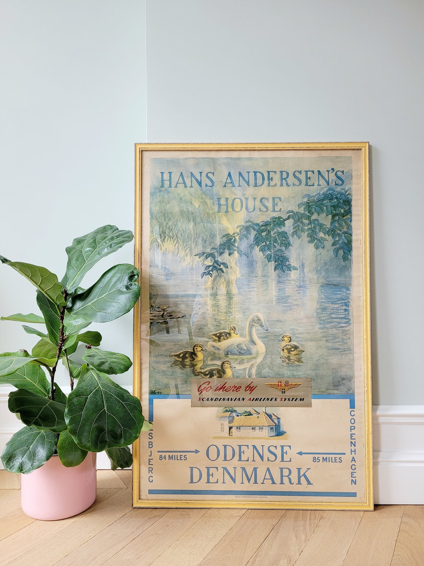 front view of a yellow framed authentic original vintage travel poster for the Hans Christian Andersen's House in Odense Denmark 
