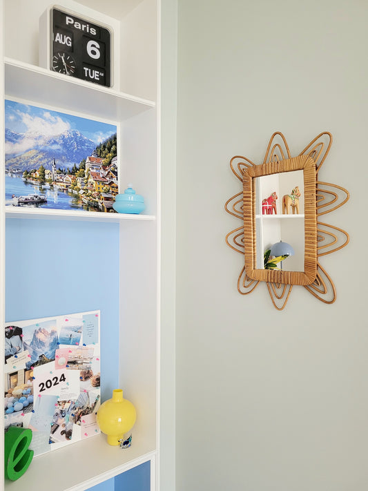 side view of a playful vintage wall mirror with rattan frame