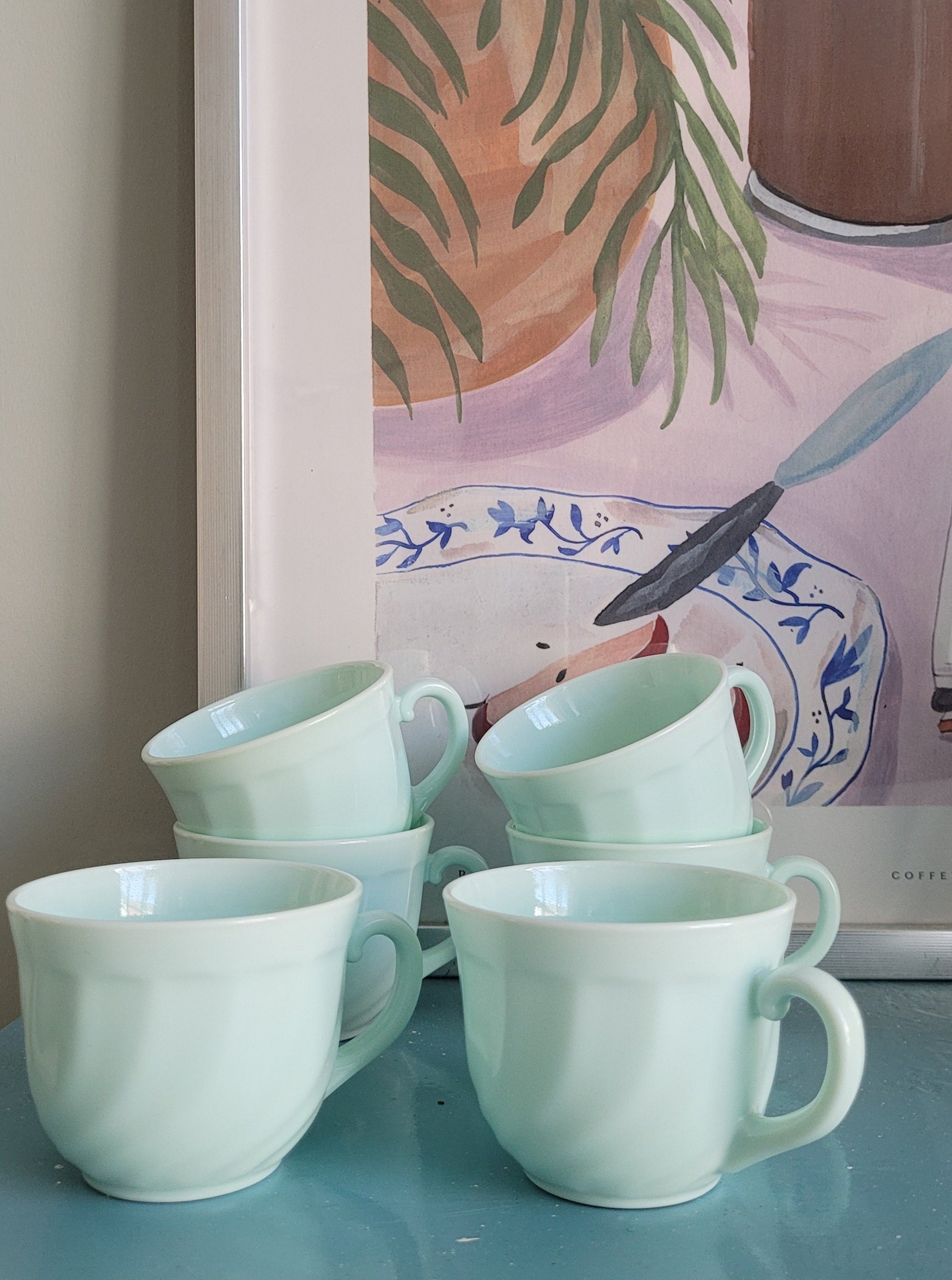 front view of six Arcopal France opaline cups for coffee or tea