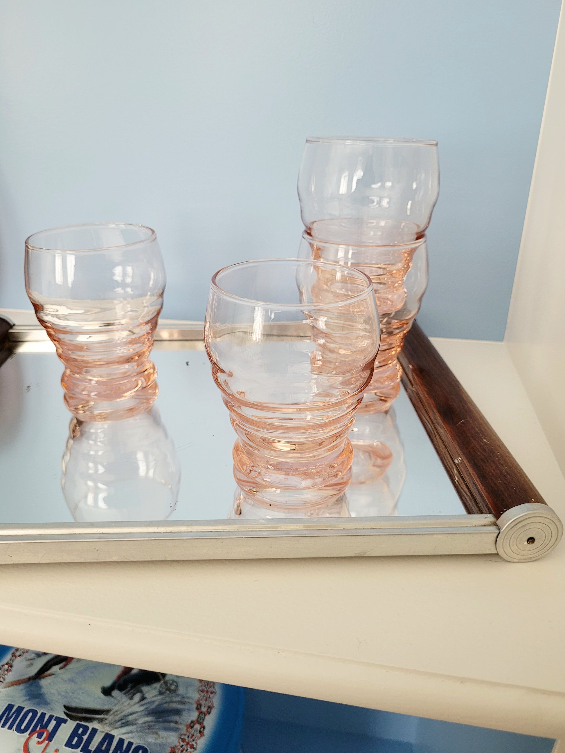 top view of coral art deco drinking glasses