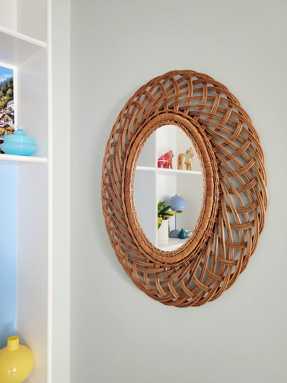 front view of a mid century large oval wall mirror 