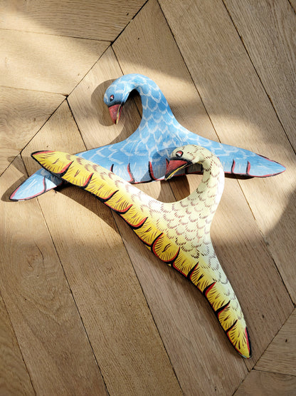 top view of two playful wooden hangers in a bird shape