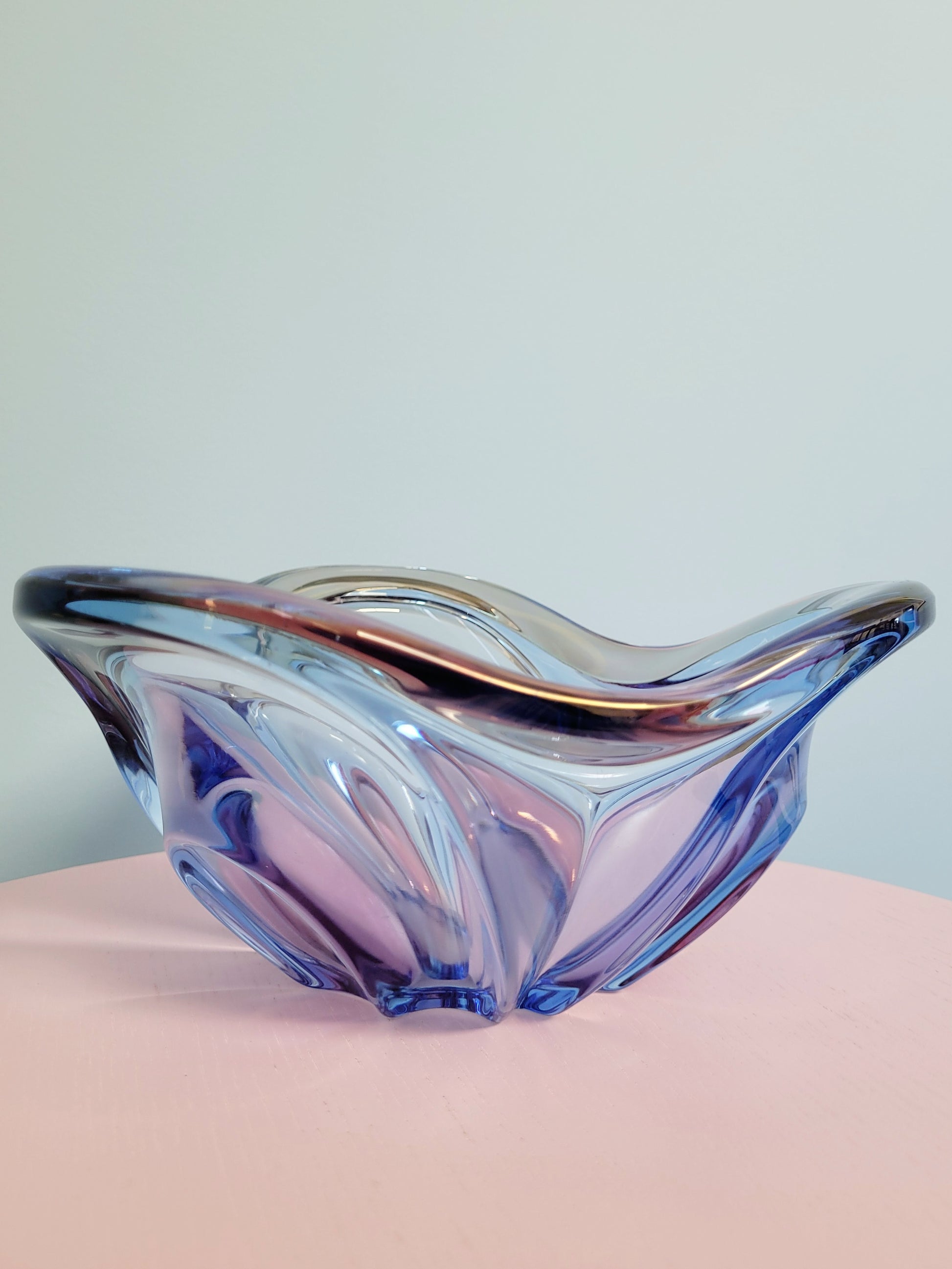 front view of a unique blue and pink glass bowl 