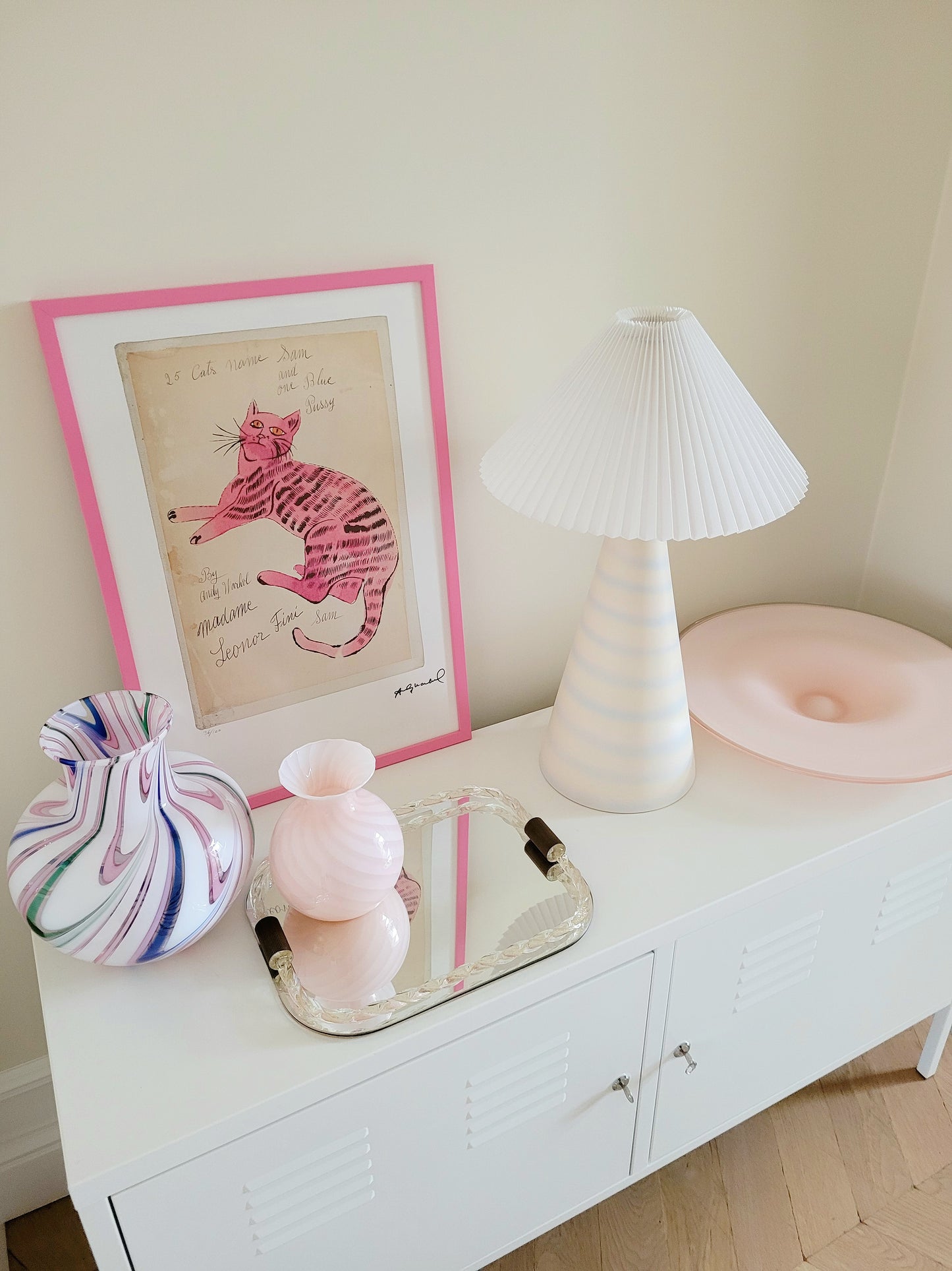 top view of the lithograph cat Sam by Andy Warholl in a pink frame