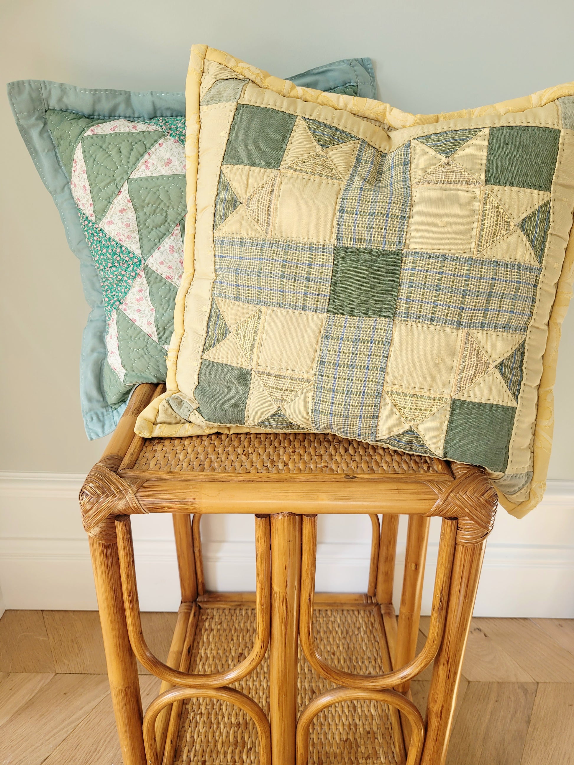 front view of quilted cushions in green and yellow hues and pattern