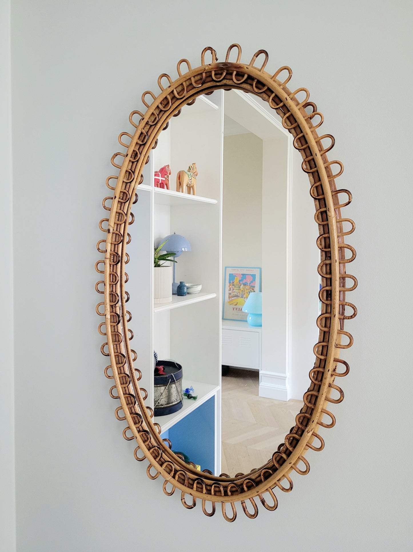 front view of a large vintage oval bamboo loop mirror from Franco Albini