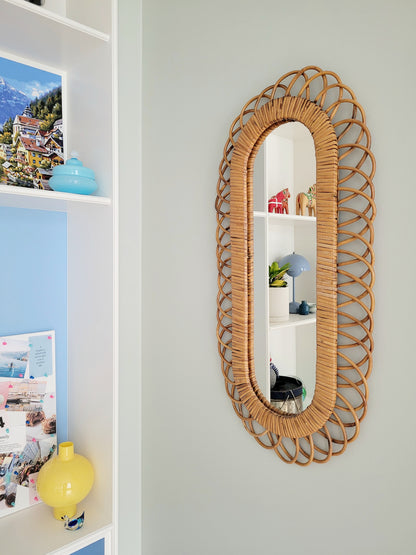 side view of an elongated vintage rattan wall mirror possibly from Franco Albini