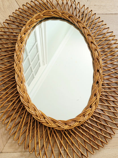 top view of an oval wall mirror in wicker texture