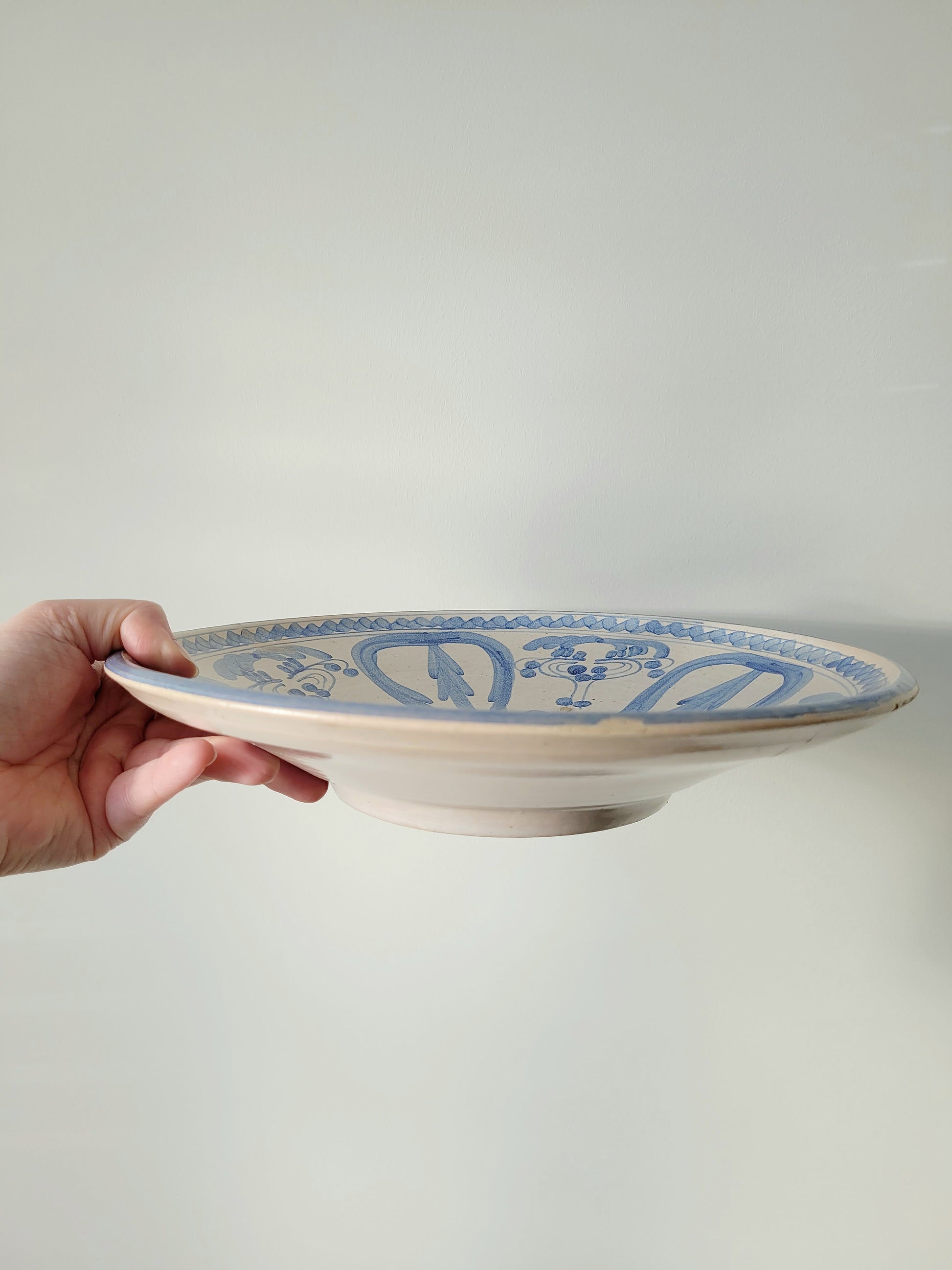 side view of a spanish ceramic wall plate from Valencia in cobalt blue