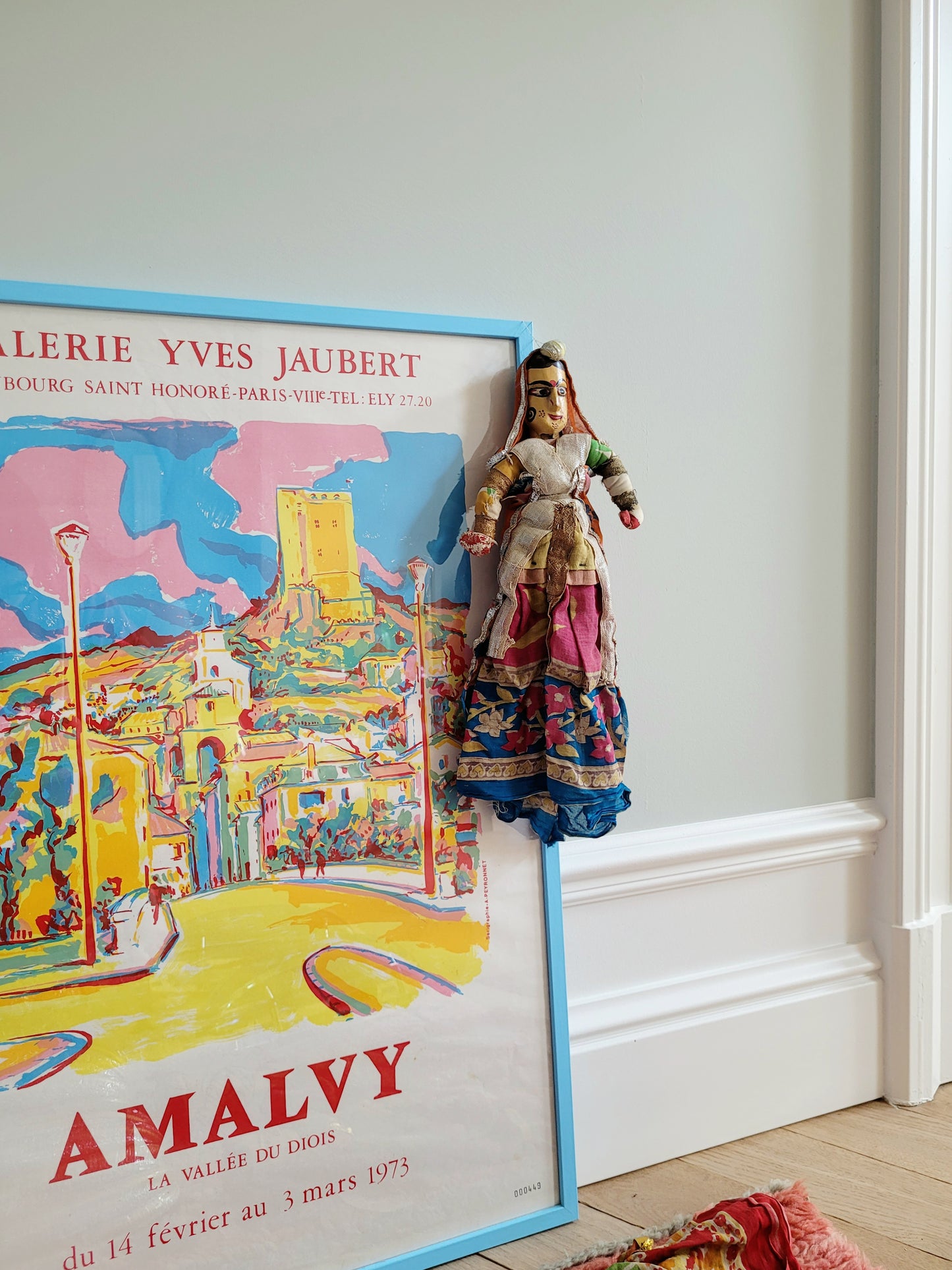 a vintage Asian textile puppet doll in vibrant colours