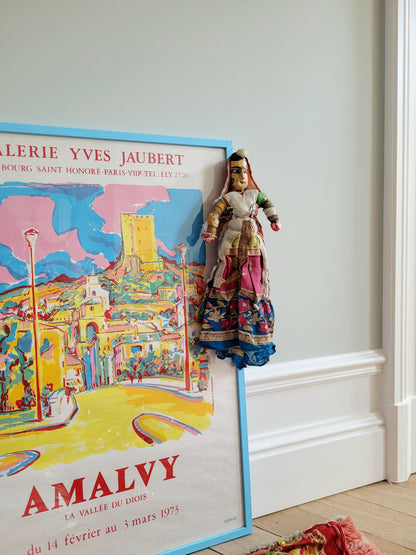 a vintage Asian textile puppet doll in vibrant colours