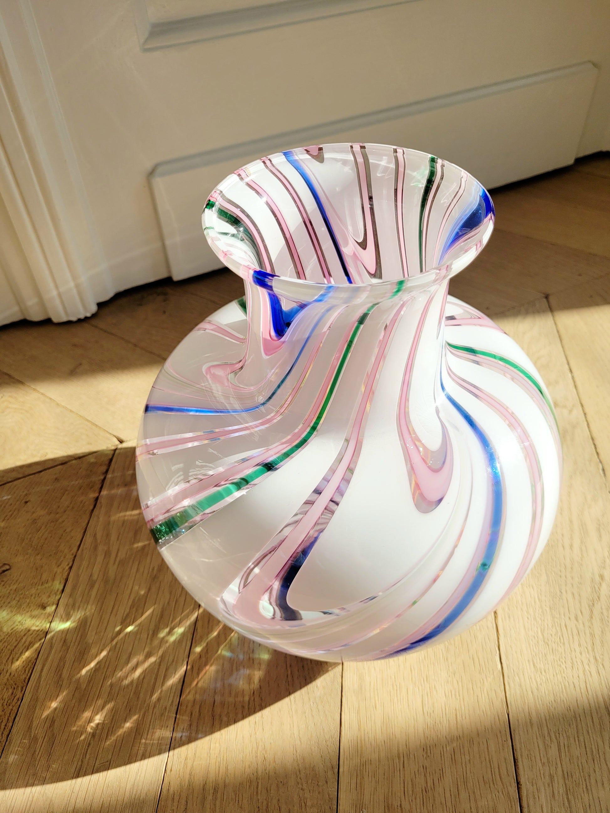 side view of a vintage Michielotto Murano multi swirl vase in a multitude of hues