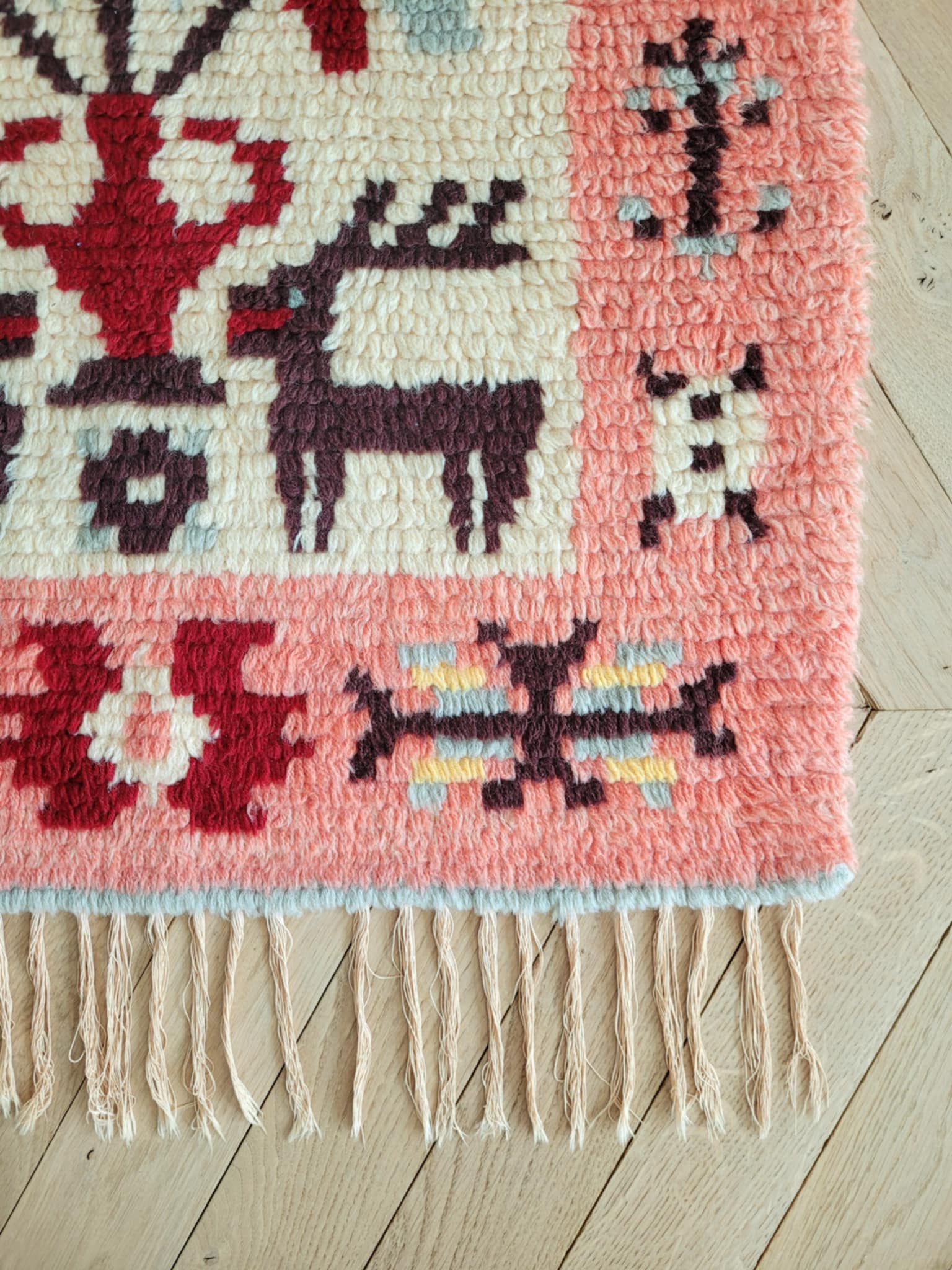 detail of a vintage colourful Scandinavian Rya rug made from wool