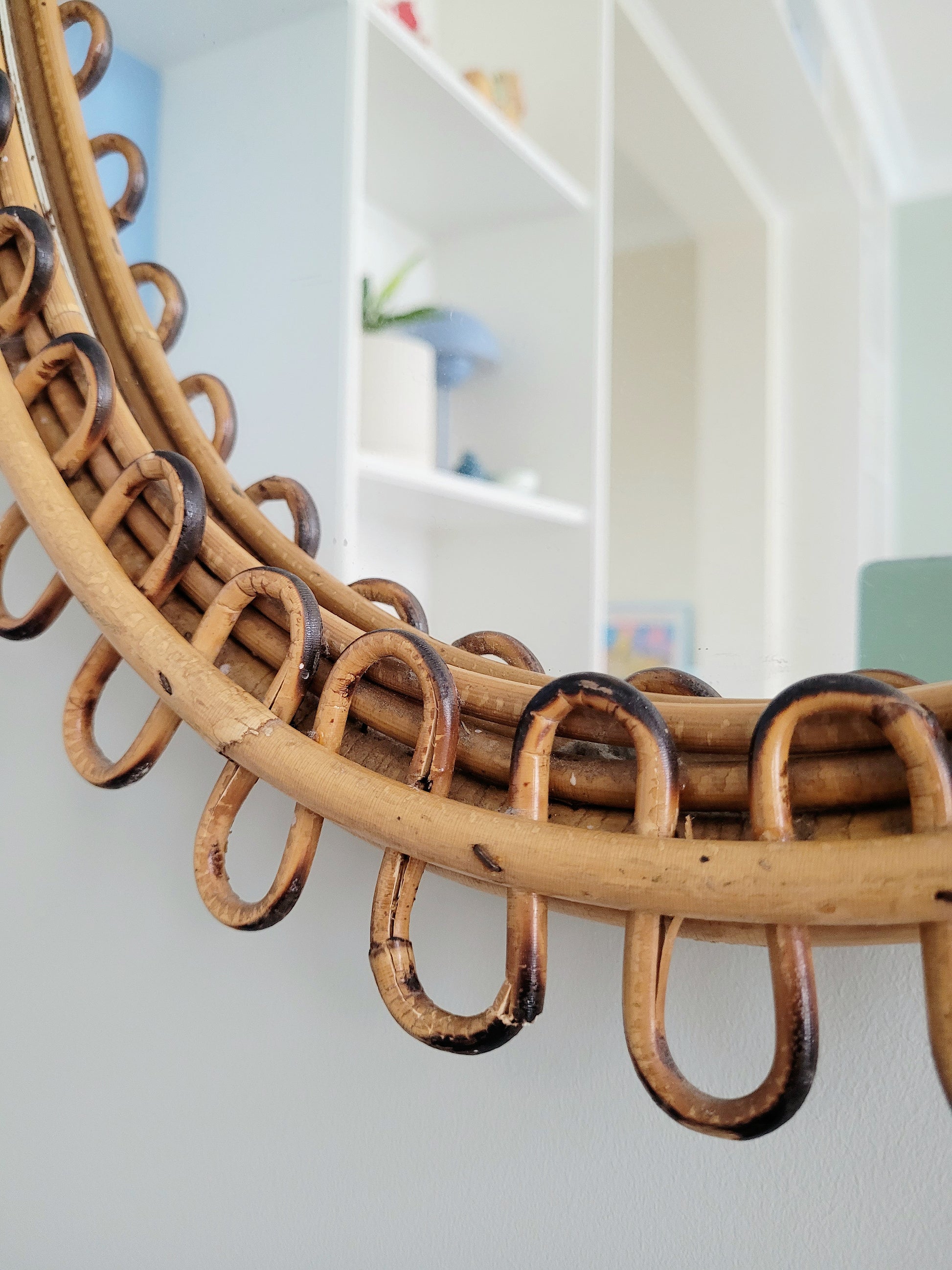 detail of a large vintage oval bamboo loop mirror from Franco Albini