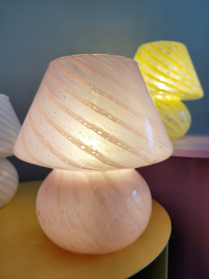 front view of a trio of small colourful vintage Murano mushroom table lamps with yellow pink and white swirls